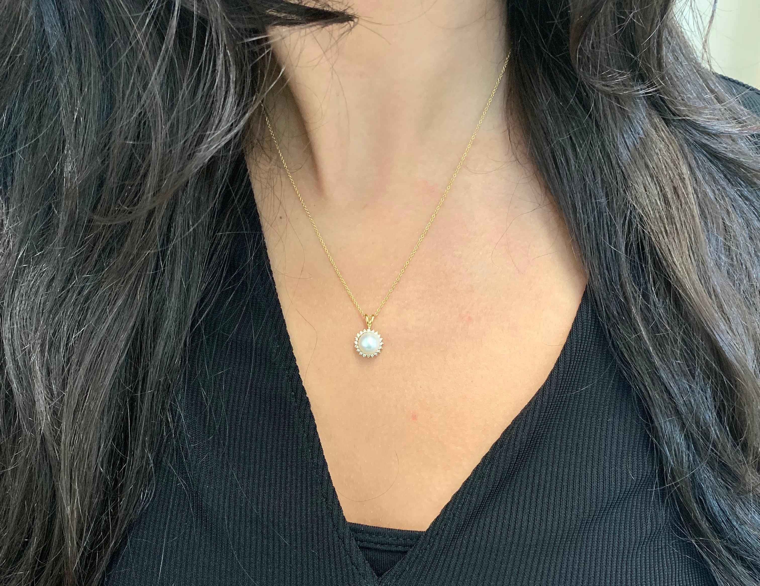 Material: 18K Yellow Gold
Center Stone Details: 1 Round Pearl at 0.70 Carats Total
Diamonds: Round Diamonds at 0.14 Carats. SI Clarity/ H-I Color

Fine one-of-a-kind craftsmanship meets incredible quality in this breathtaking piece of jewelry.

All