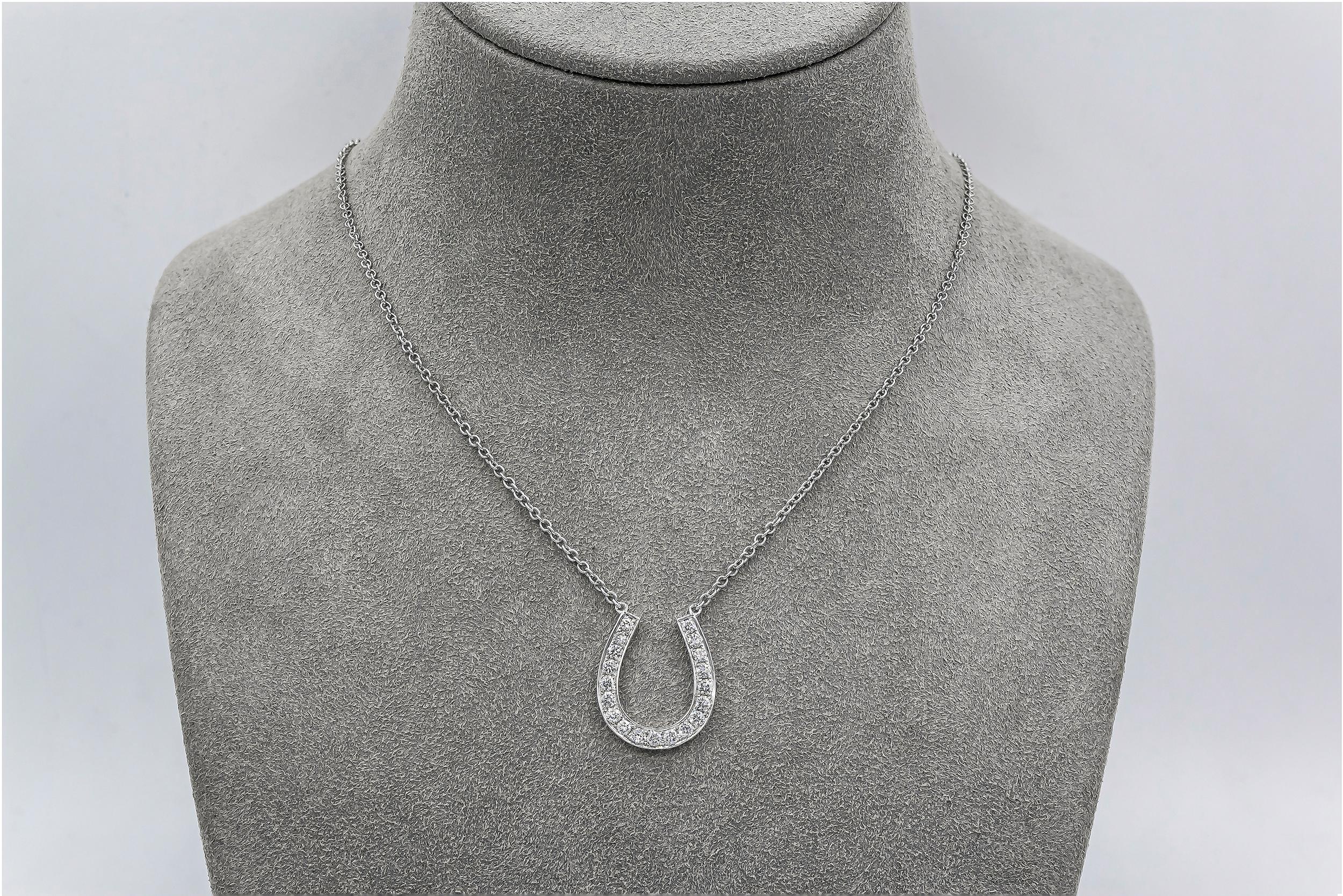 Showcasing round brilliant diamonds set in a unique horse shoe design. Diamonds weigh 0.70 carats total. Made in 18K White Gold. Suspended on a 16 inch white gold chain. Perfect for your everyday use or a gift to loved ones. 

Roman Malakov is a