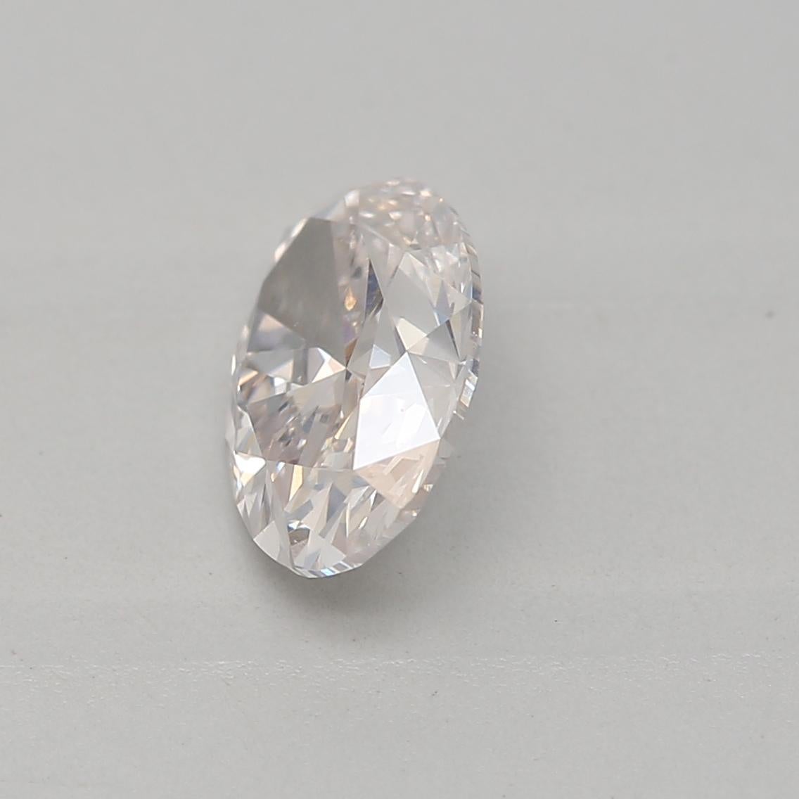 Women's or Men's 0.70 Carat Very Light Pink Oval Cut Diamond SI1 Clarity GIA Certified For Sale