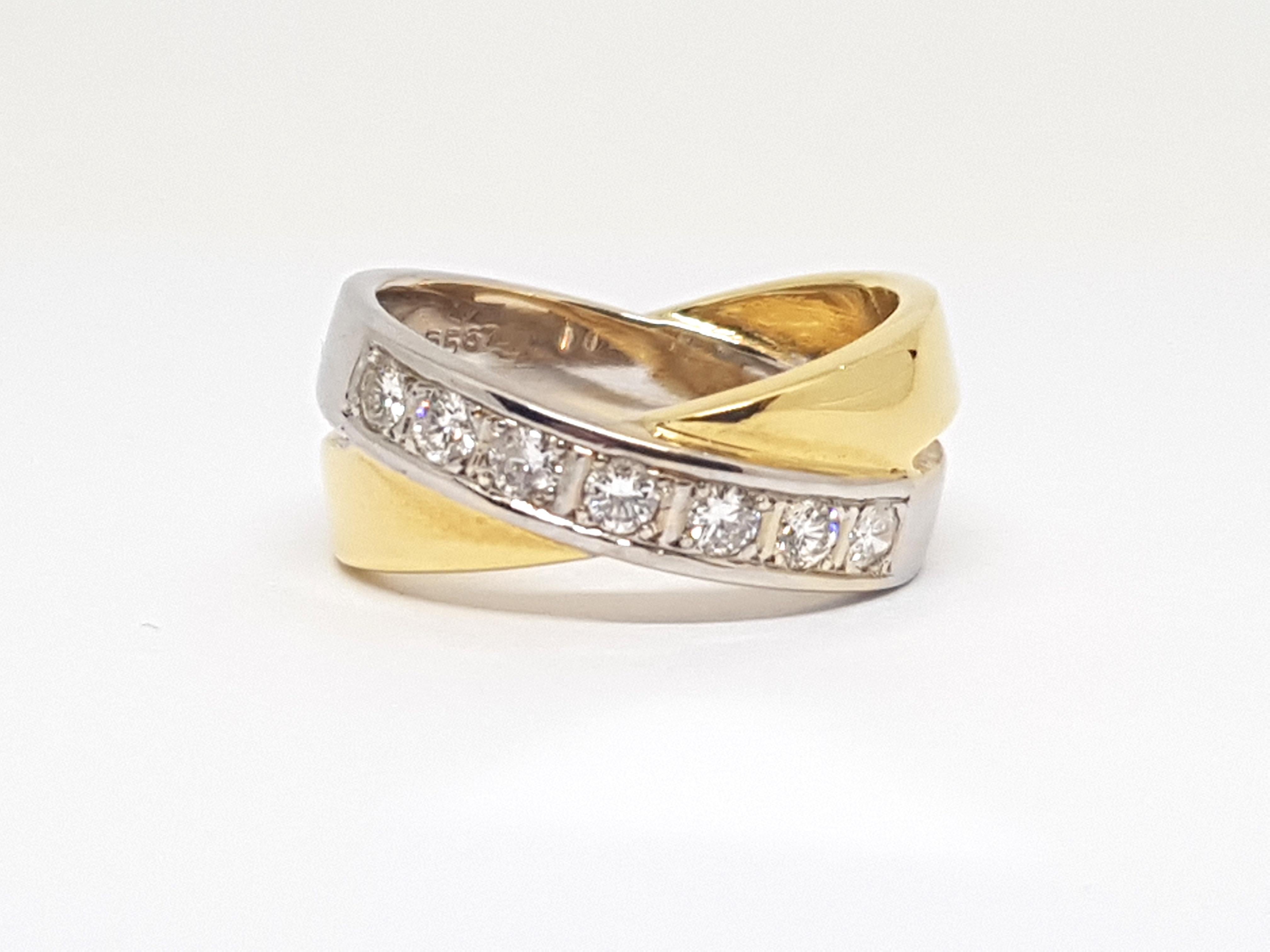 Gold: 18K Yellow & White Gold. 
Weight: 10,03 gr. 
Diamonds: 0,70ct. G / VS 
Width: 0,9 cm 
Ringsize: 54 / 17,25mm 
Free resizing of ring up to size 70 / 22mm 
Shipping: free worldwide insured shipping 
Please take a look at my other pieces of