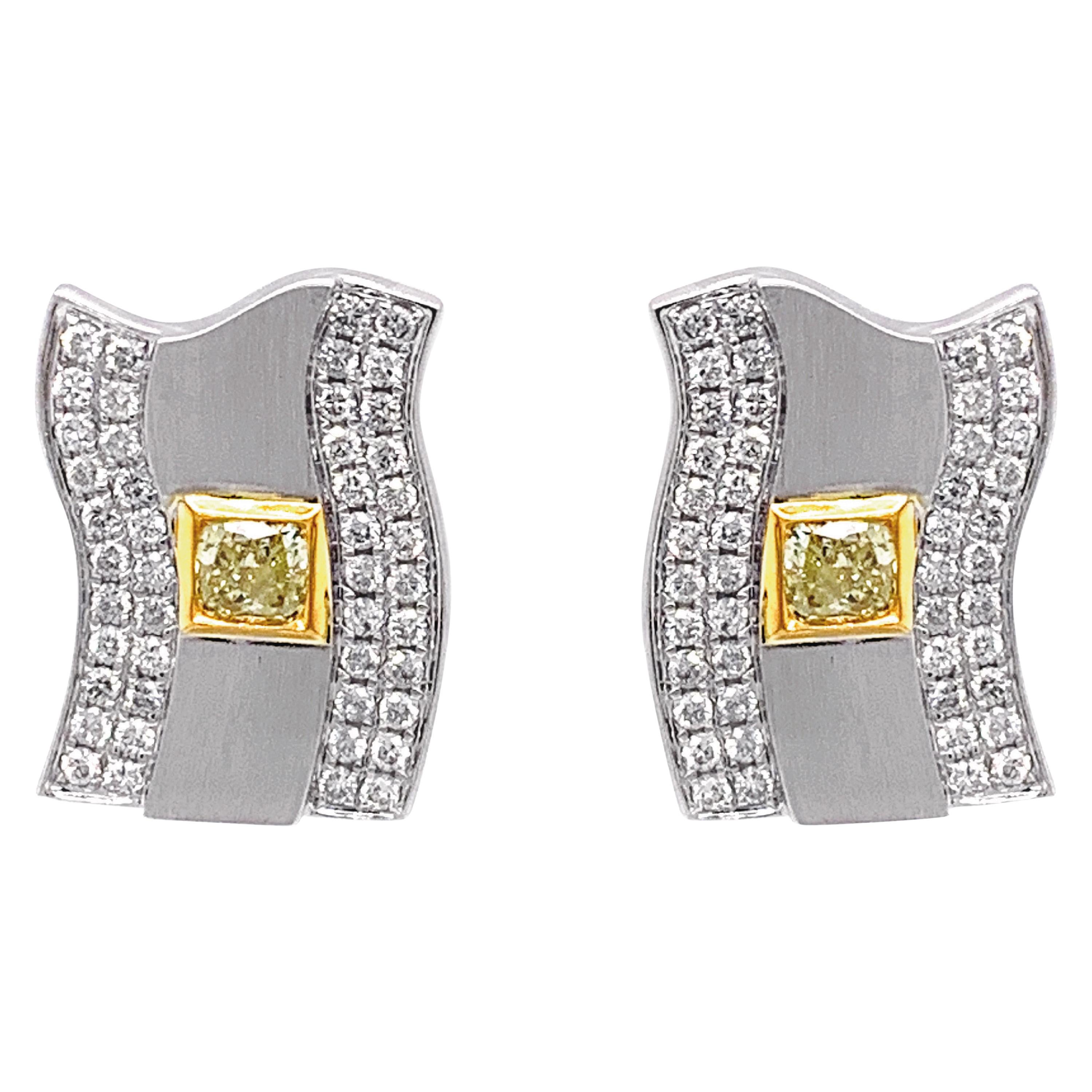 0.70 Carat Fancy Intense Yellow Diamond & 1.01 Carat White Diamond Stud Earring For Sale