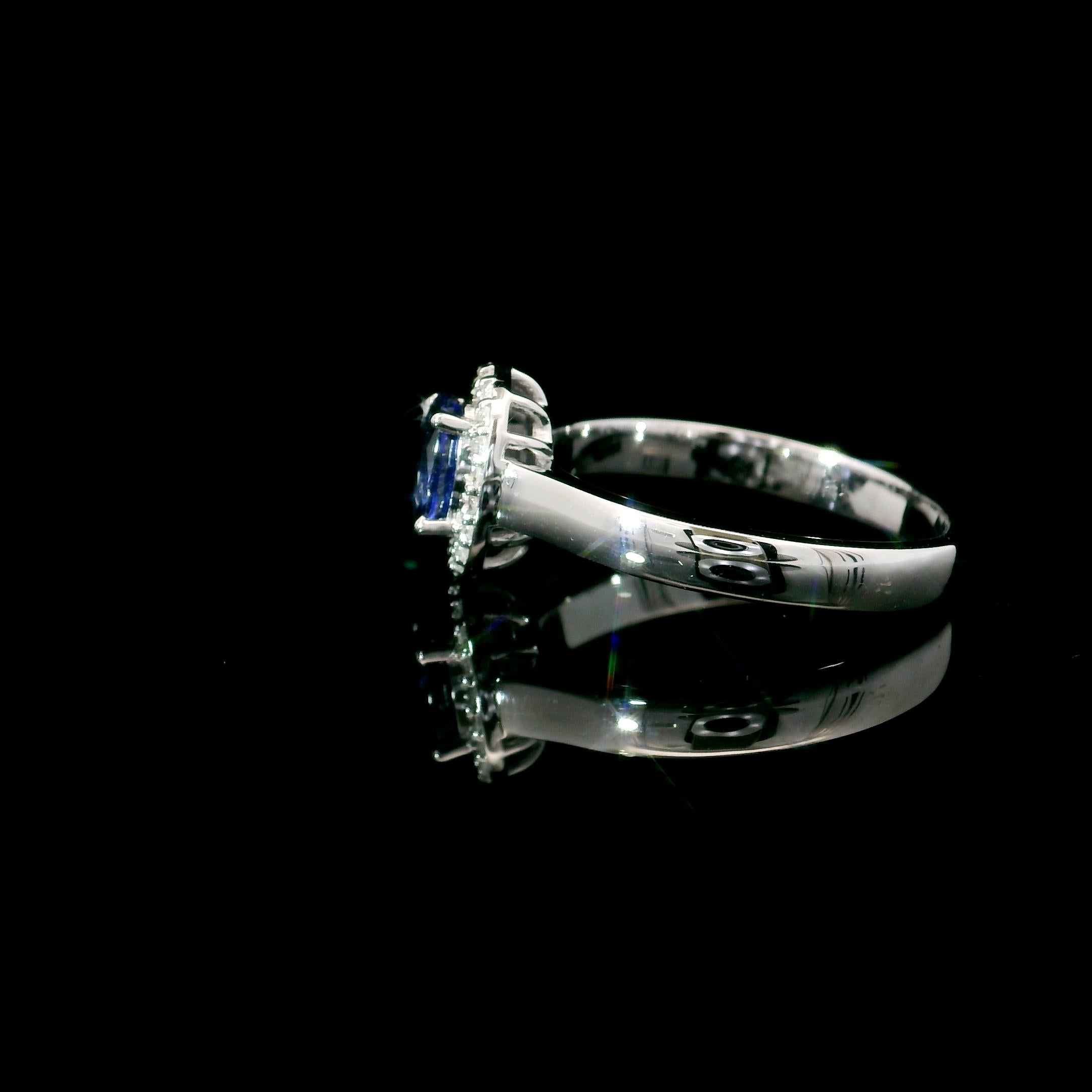 18kt white gold Sapphire Ring
  
  Gold colour & karat: White gold 18kt
  Weight: 3.68 grams
  
  Set with-
  Stone type: Diamond
  Shape: Oval
  Carat: 0.70 cts
  Colour: blue Colour
  
  Surrounding Stones: Diamonds
 1) White Diamonds
  Carat