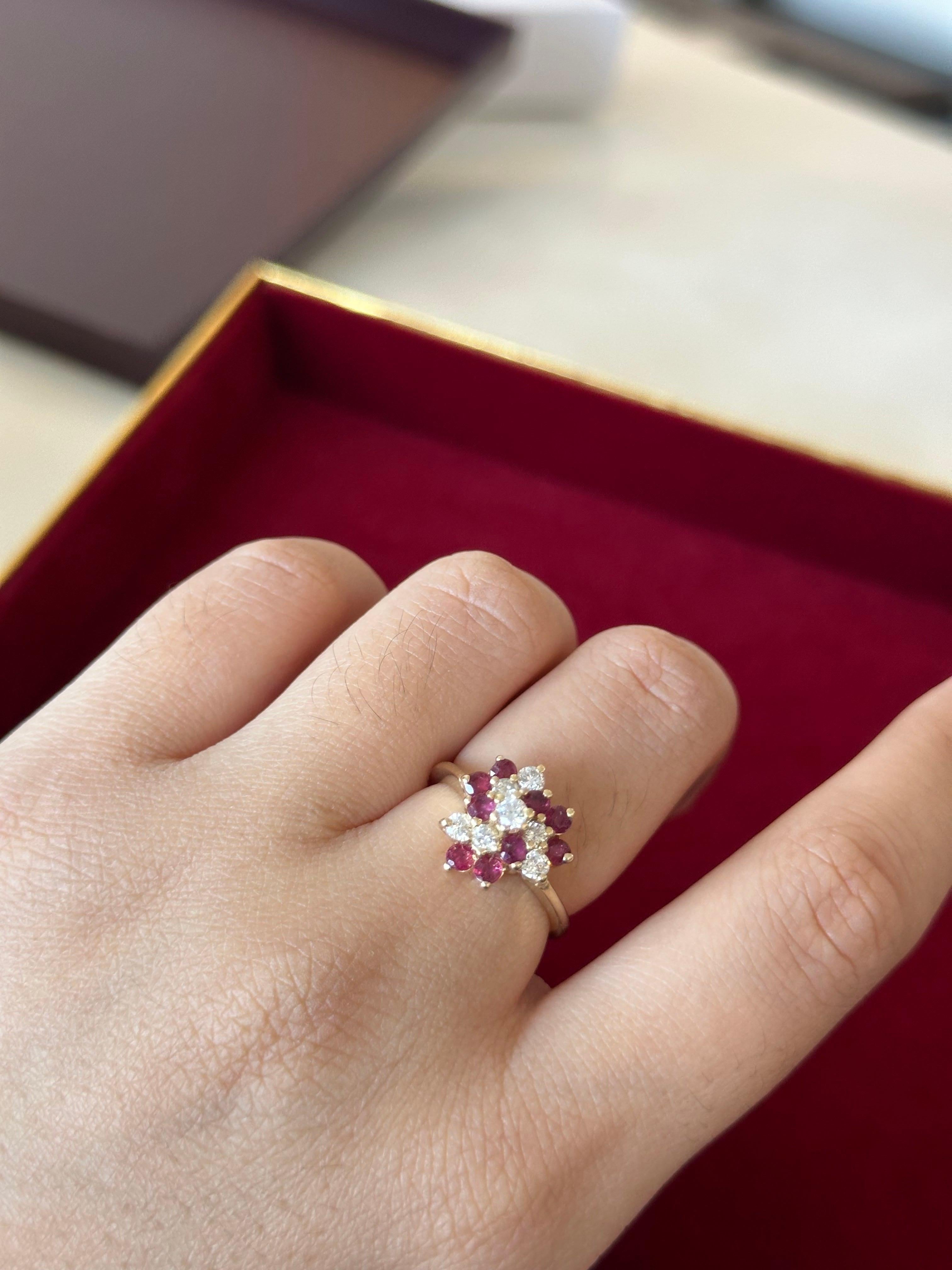 14K Yellow Gold Ring with 0.70 ctw of natural diamonds and 0.90 ctw natural ruby. 
Metal: 14K Solid Gold.
Diamond color: E-F.
Diamond clarity: VS1-VS2.
Diamond weight: 0.70 ctw.
Ruby weight: 0.90.
Total ring weight: 4.14 grams.
