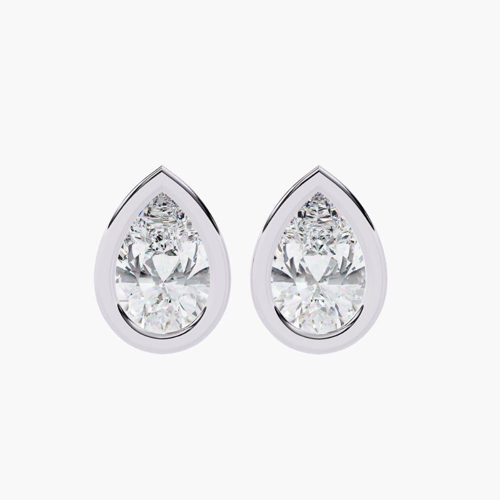 Product Details
Metal Type: 14k Gold
Diamond Type: Natural Diamond
Carat Total Weight (ctw): 0.70 Ctw
Diamond Cut: Pear Cut
Total Number of Stones: 2 pcs
Diamond Color: Near Colorless 
Diamond Clarity: SI+
Setting Type: Bezel Setting
Closure: