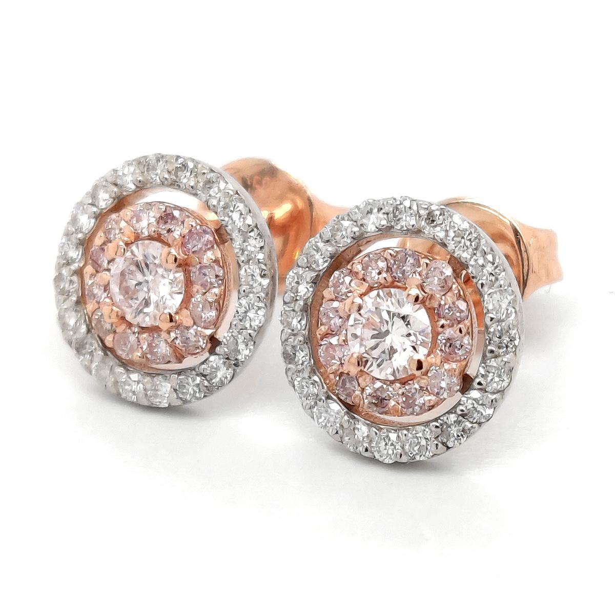 FOR U.S. BUYERS NO VAT

Enjoy colorfulness with these fancy earrings made with 14kt white and pink gold and shining white and pink diamonds totaling 0.46 carats, circling natural light pink central diamonds weighing 0.24 carats in total. 
For more