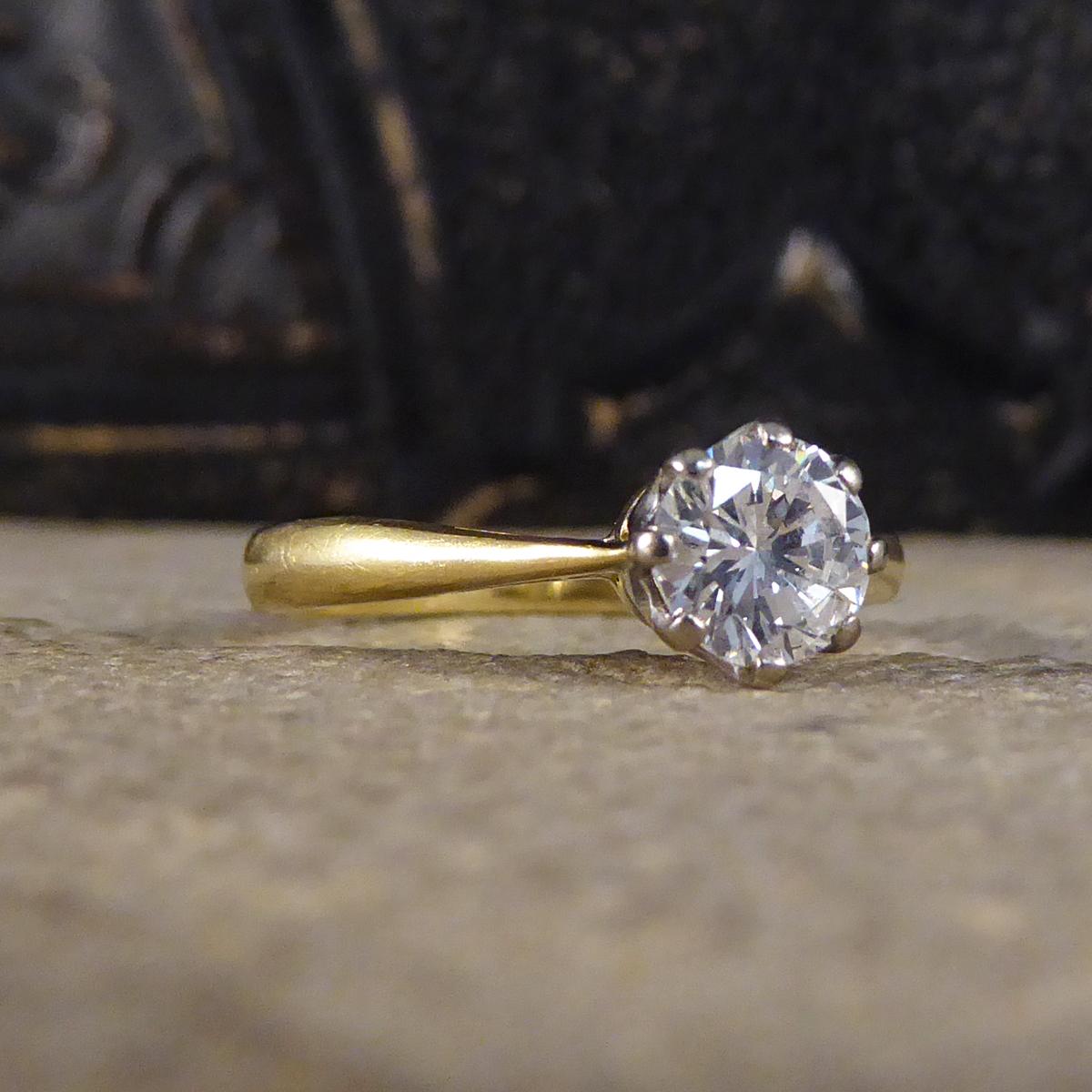 This gorgeous engagement ring holds a Brilliant cut Diamond weighing 0.70ct and is set in an 18ct White Gold eight claw setting leading down to an 18ct band fully hallmarked on the inside of the band made in 1979 in London. A classic solitaire ring