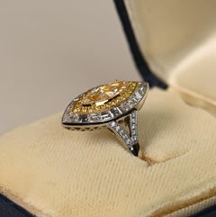 0.70ct Marquise Engagement Ring. Fancy Light Yellow Diamond Ring Platinum VS2