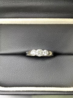 0.70ct round diamond trilogy engagement ring in platinum.