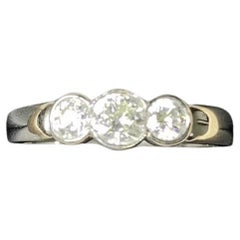 0.70ct round diamond trilogy engagement ring in platinum.