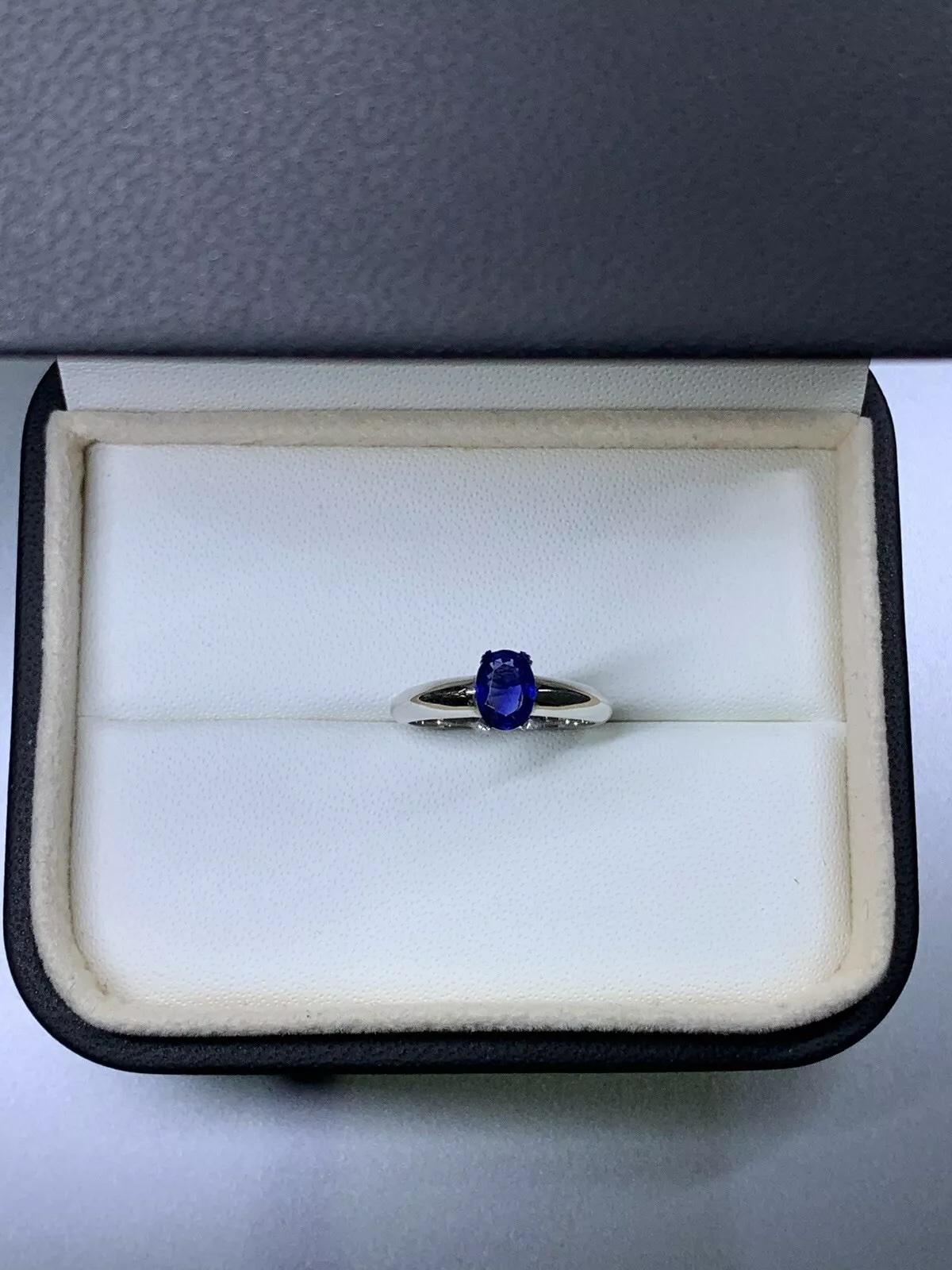 0.70ct Sapphire oval blue ceylon solitaire engagement ring in 18ct white gold.