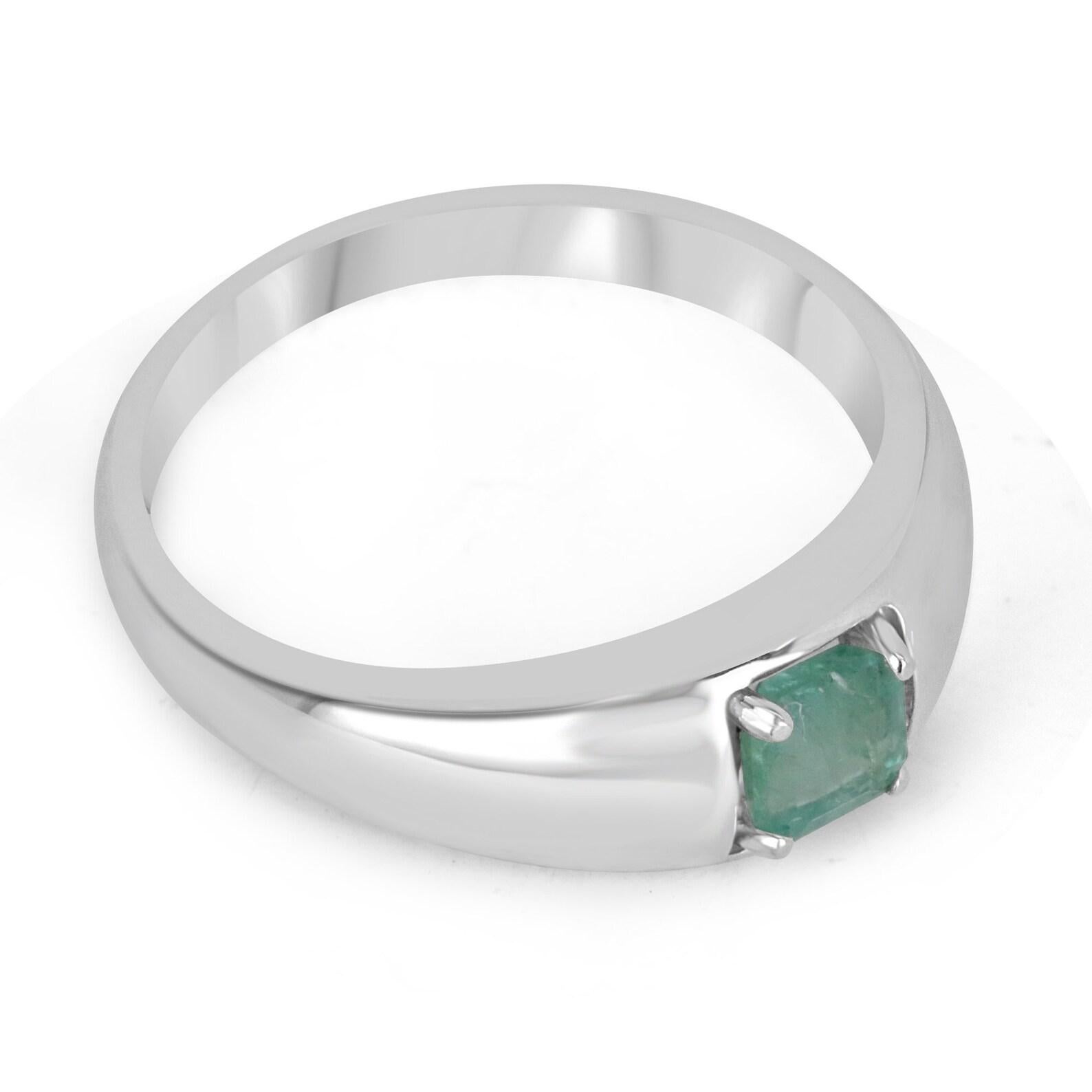 A pretty emerald solitaire ring. This piece features a natural Asscher cut emerald set in a simple four-prong setting, crafted in sterling silver.

Setting Style: Prong
Setting Material: Sterling Silver .925

Main Stone: Emerald
Shape: Asscher