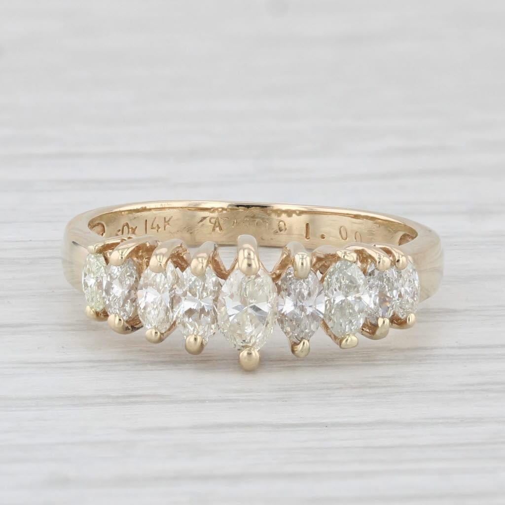 Gemstone Information:
- Natural Diamonds -
Total Carats - 0.70ctw
Cut - Marquise Brilliant
Color - I - K
Clarity - VS2 - SI1

Metal: 14k Yellow Gold
Weight: 2.8 Grams 
Stamps: 14k
Face Height: 6.6 mm 
Rise Above Finger: 5.4 mm
Band / Shank Width: