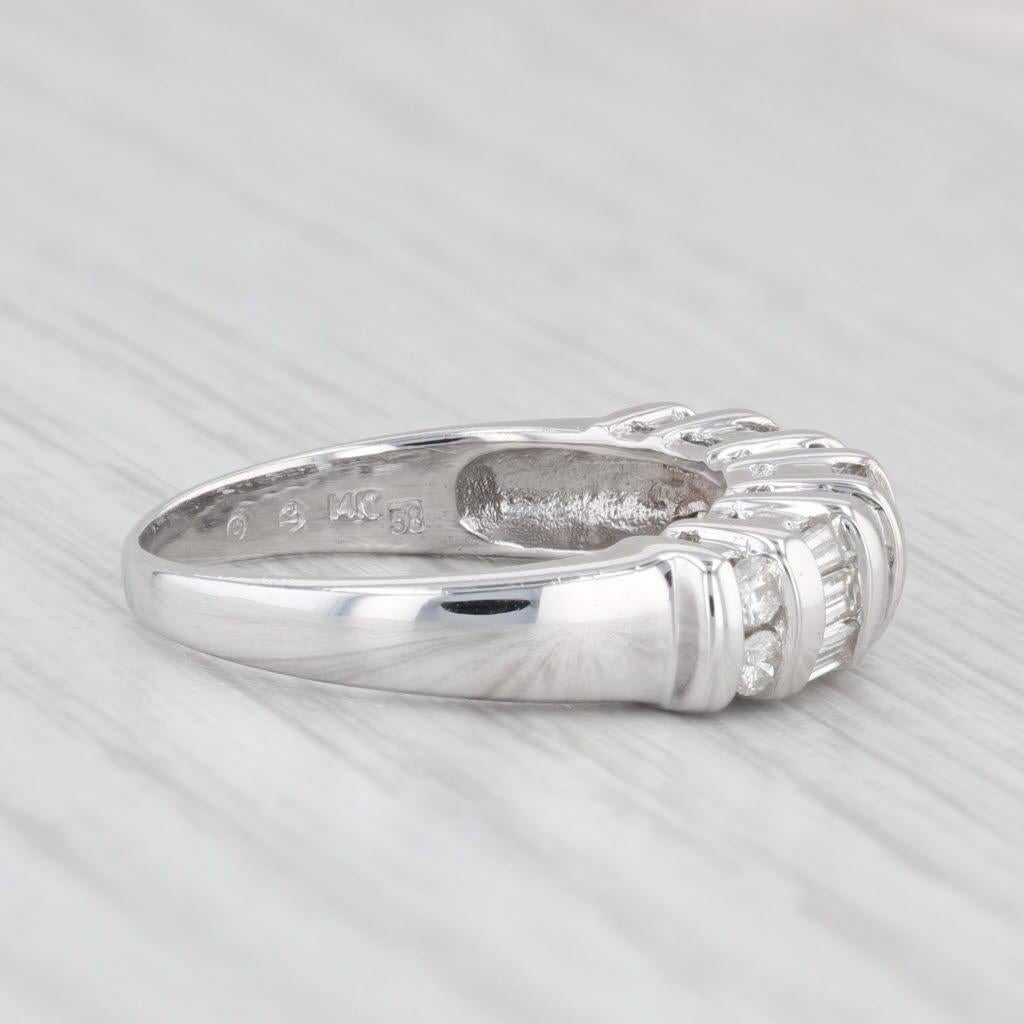 Gemstone Information:
- Natural Diamonds -
Total Carats - 0.70ctw
Cut - Round Brilliant 0.25ctw, Baguette 0.45ctw
Color - G - H
Clarity - SI2 - I1

Metal: 14k White Gold
Weight: 3.8 Grams 
Stamps: 14k
Face Height: 5.1 mm 
Rise Above Finger: 5.3