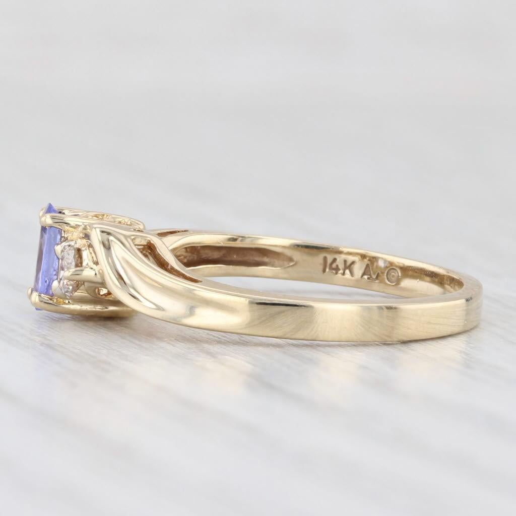 Gemstone Information:
- Natural Tanzanite -
Carats - 0.50ct 
Cut - Oval
Color - Dark Blue
Treatment - Heated

- Natural Diamonds -
Total Carats - 0.20ctw
Cut - Round Brilliant
Color - K - L
Clarity - I1 - I2

Metal: 14k Yellow Gold
Weight: 3.1 Grams