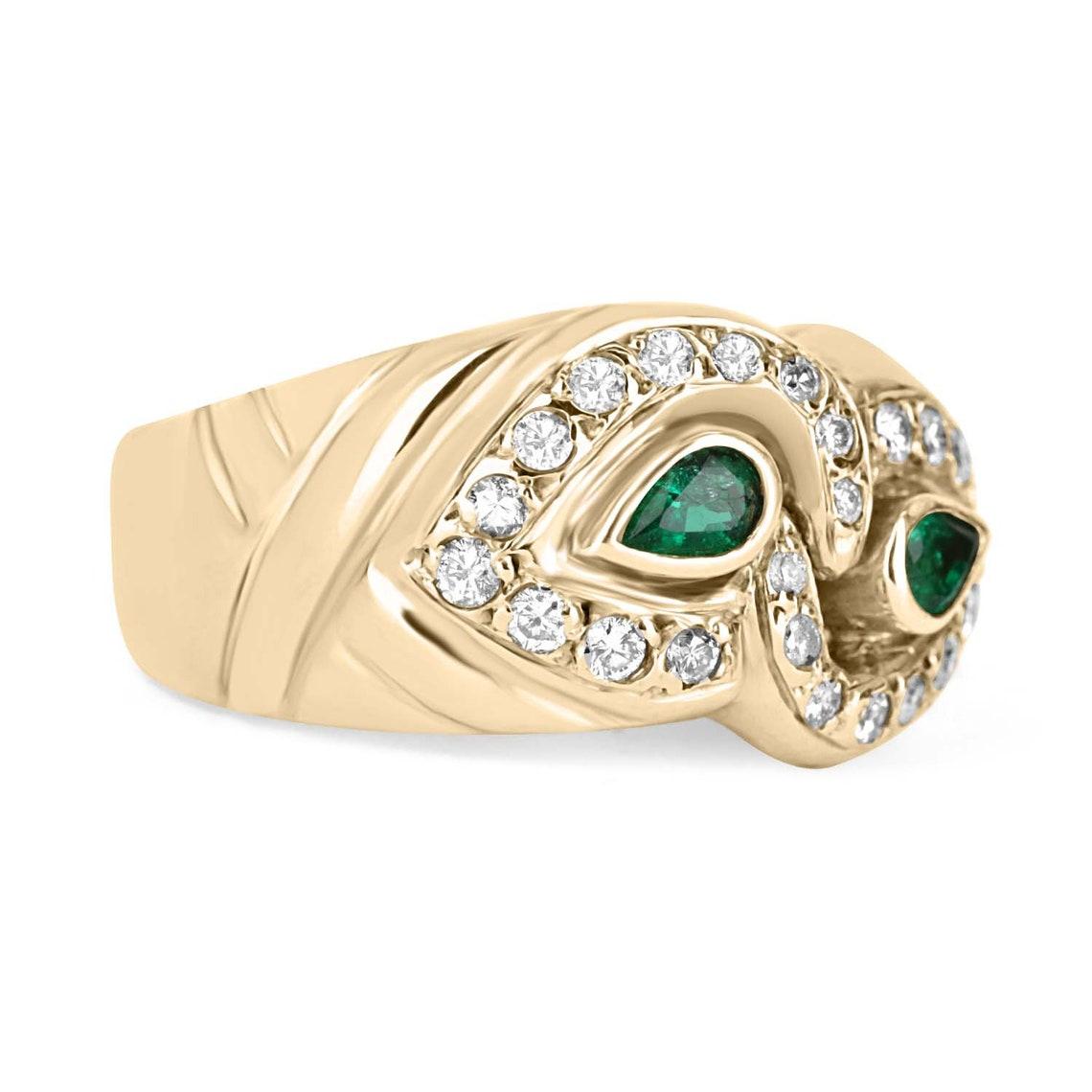 Featured here is an impressive natural pear Colombian emerald and diamond cocktail ring 18K. This unique piece is full of decadence and beauty. The smoothly grooved lines of this ring provide a whimsical, sophisticated look while achieving a