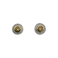 0.71 Carat Fancy Vivid Yellow Diamond Bezel Halo Stud Earrings in 18K White Gold