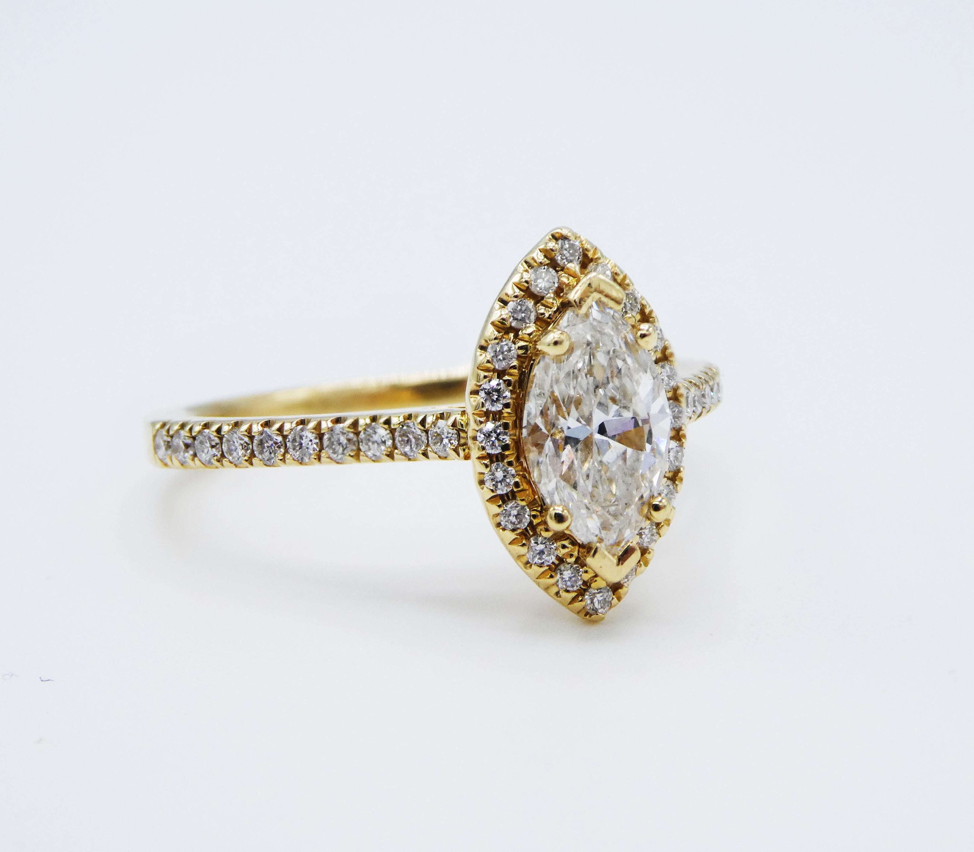 0.71ct 14K Yellow Gold Marquise Halo Diamond Engagement Ring Size 6

Metal: 14k yellow gold
Weight: 2.79 grams
Diamonds: 1 marquise shaped diamond, .71cts (marked in shank) H-I SI, 40 small round brilliant cut diamonds on the halo/band, .21 CTW