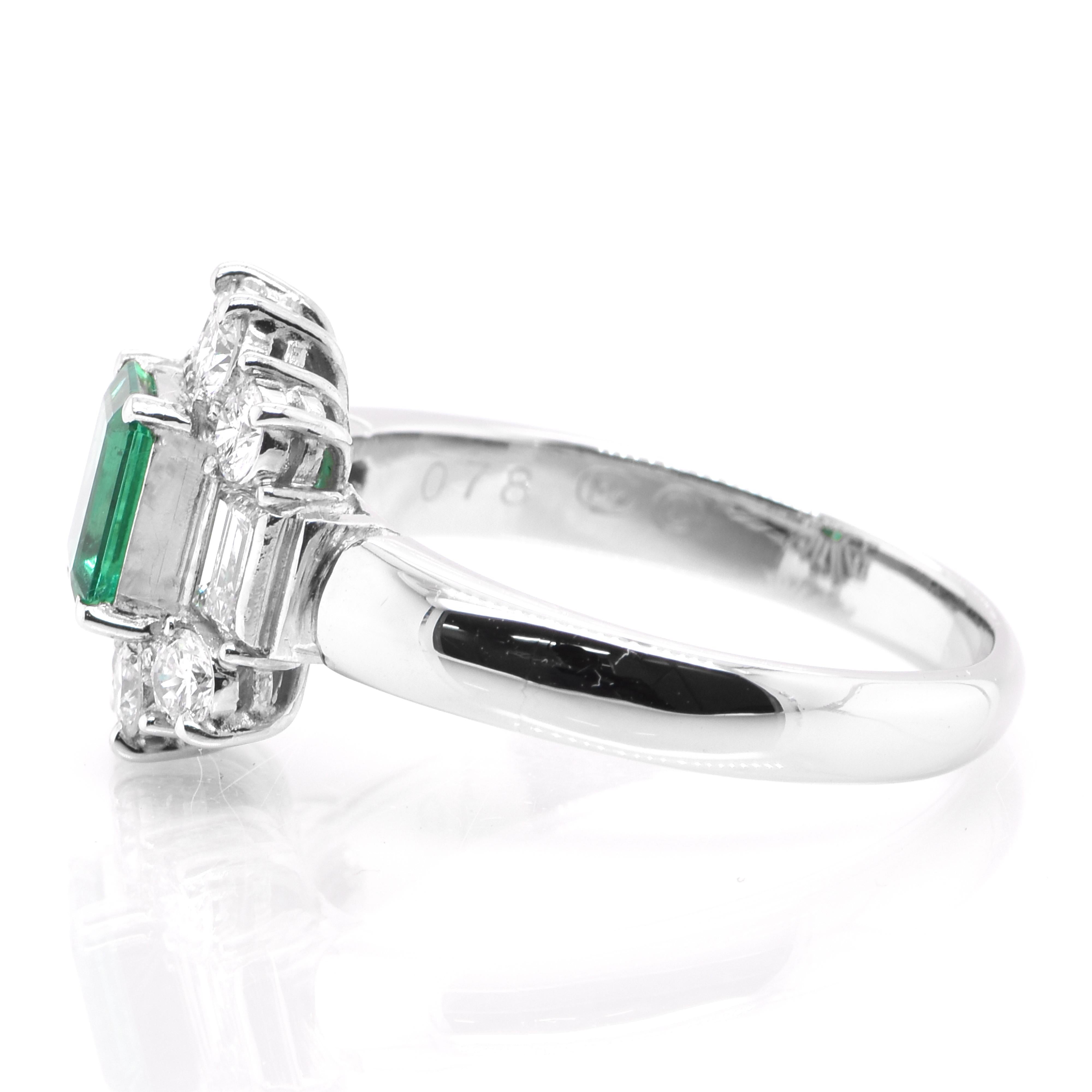 Emerald Cut 0.71 Carat Natural Emerald and Diamond Halo Ring Set in Platinum For Sale