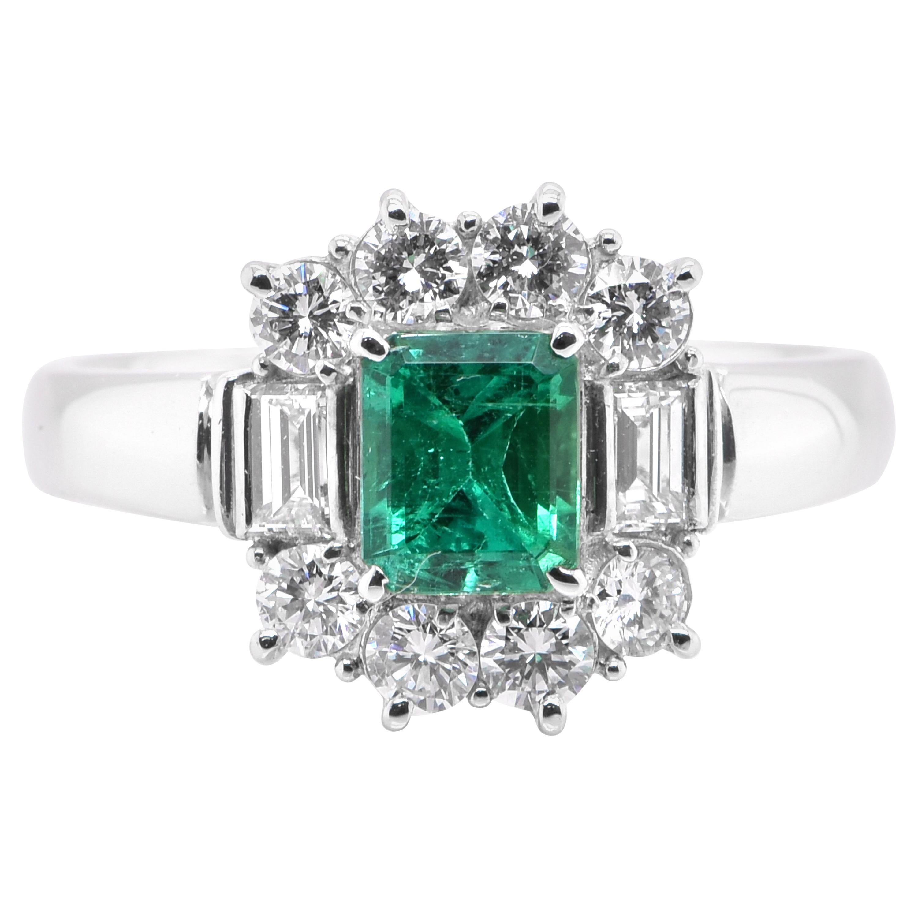 0.71 Carat Natural Emerald and Diamond Halo Ring Set in Platinum For Sale