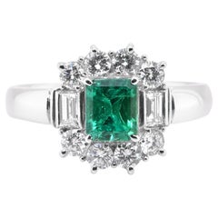 0.71 Carat Natural Emerald and Diamond Halo Ring Set in Platinum