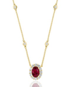 0.71 Carat Oval Cut Ruby and Diamond Pendant Necklace in 14K Yellow Gold