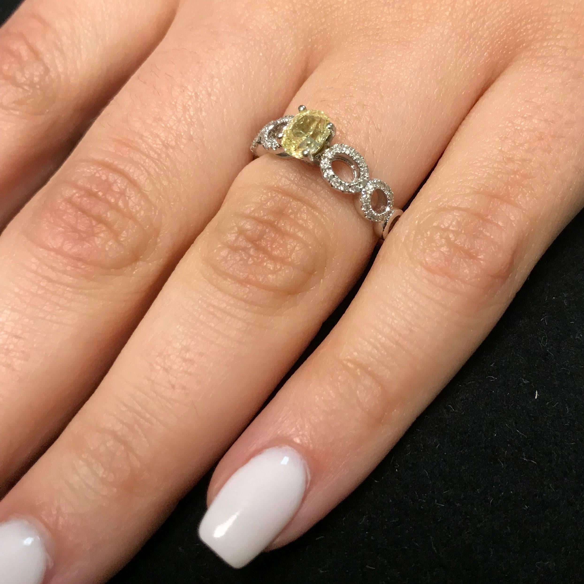 0.71 Carat Oval Cut Yellow Diamond Engagement Ring In New Condition In GREAT NECK, NY
