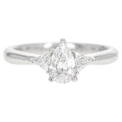 0.71 Carat Pear Diamond Trillion Three Stone Ring