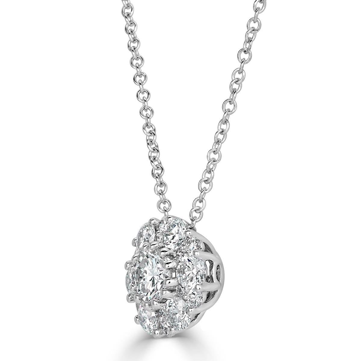 Handcrafted in 18k white gold, this ravishing diamond pendant showcases 0.71ct of round brilliant cut diamonds hand set in an exquisite floral pattern. The diamonds are graded at F-G in color, VS1-VS2 in clarity.
