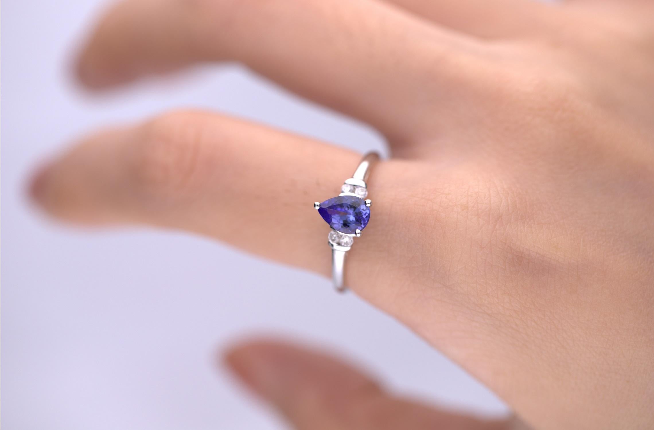 Stunning, timeless and classy eternity Unique ring. Decorate yourself in luxury with this Gin & Grace ring. The 10k White Gold jewelry boasts Pear-Cut Prong Setting Genuine Tanzanite (1pcs) 0.71 Carat and Round-Cut Prong Setting Diamond (4 pcs) 0.09