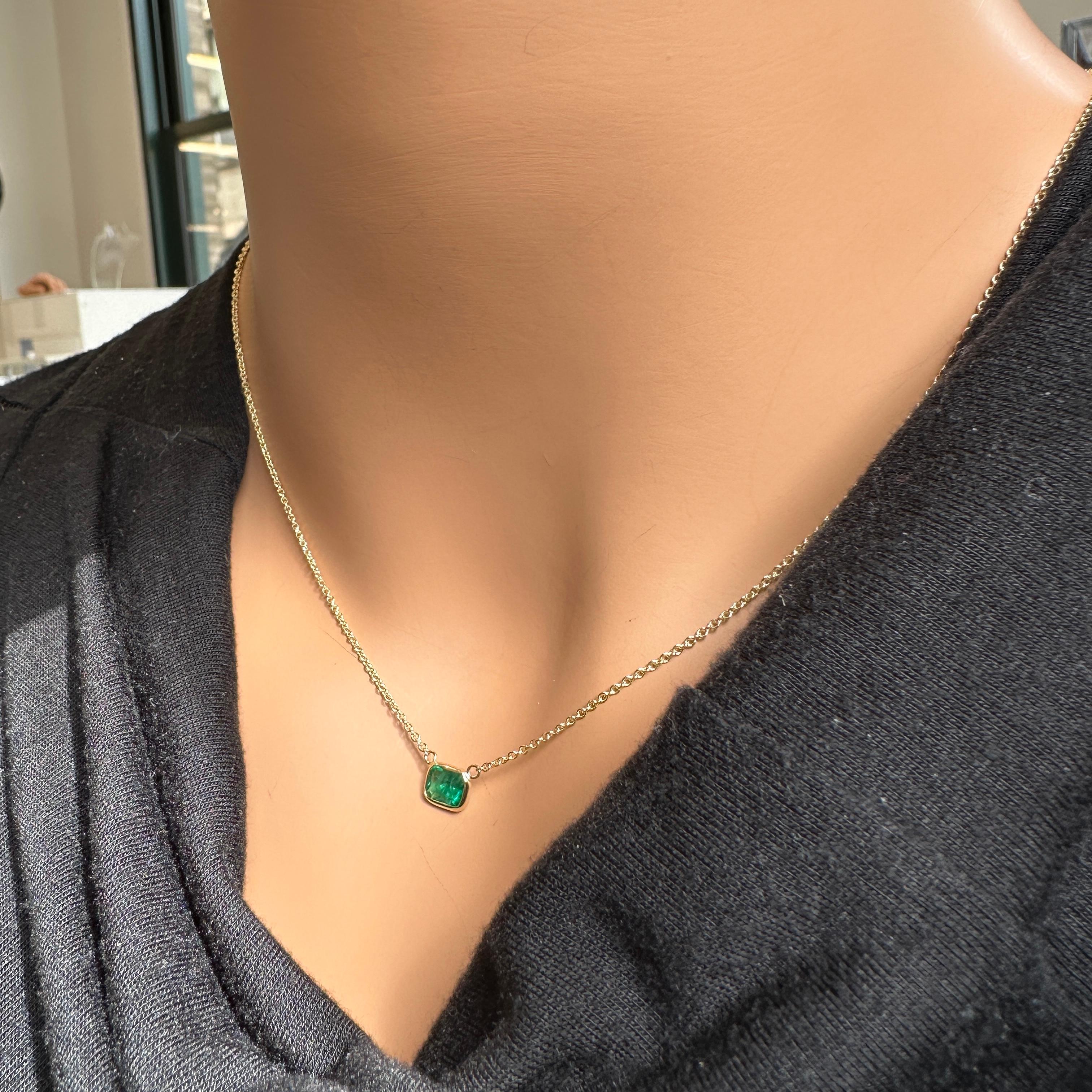 Emerald Cut 0.71 Carat Weight Green Emerald Solitaire Necklace in 14k Yellow Gold For Sale