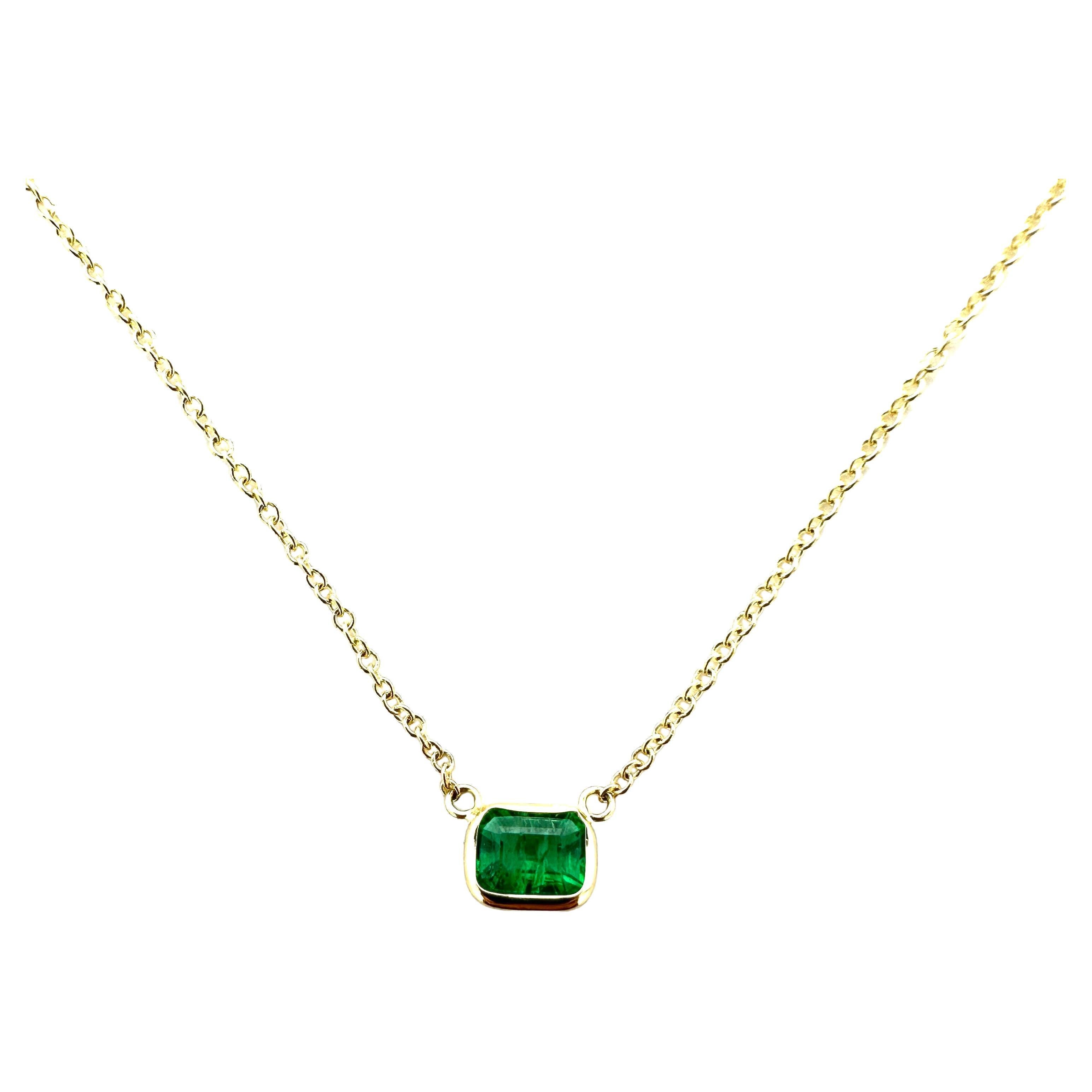 0.71 Carat Weight Green Emerald Solitaire Necklace in 14k Yellow Gold For Sale