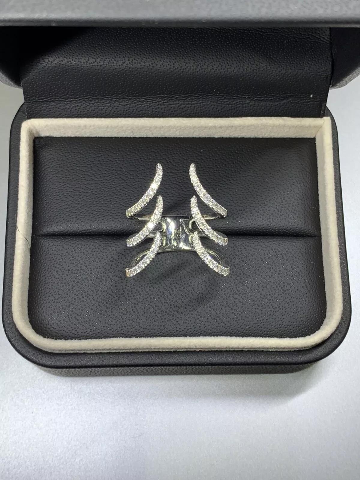 0.71ct Diamond eternity cocktail ring in 18k white gold.

Diamonds F colour VS1 clarity.

Hallmarked.

Box and valuation included.

The ring can be resized.