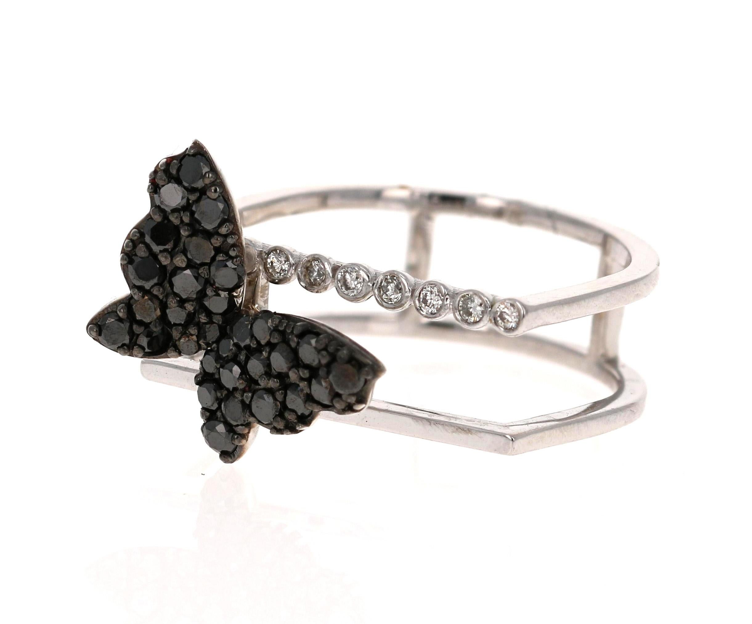This ring has 30 Round Cut Black Diamonds that weigh 0.65 Carats and 7 Round Cut Diamonds weighing 0.07 Carats (Clarity: SI2, Color:F).  The total carat weight of the ring is 0.72 Carats. 

It is beautifully set in 14 Karat White Gold and is
