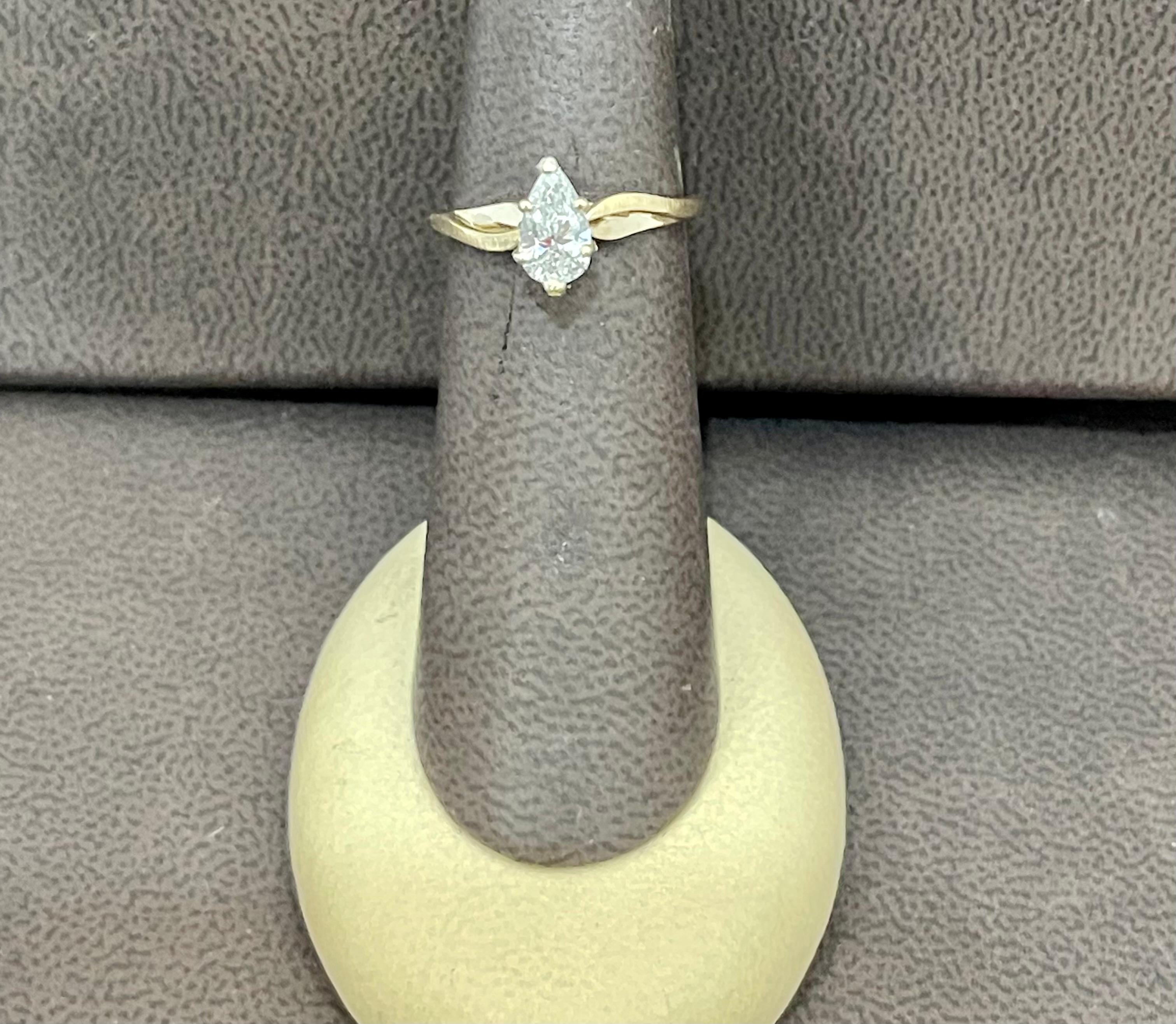 solitaire teardrop engagement ring