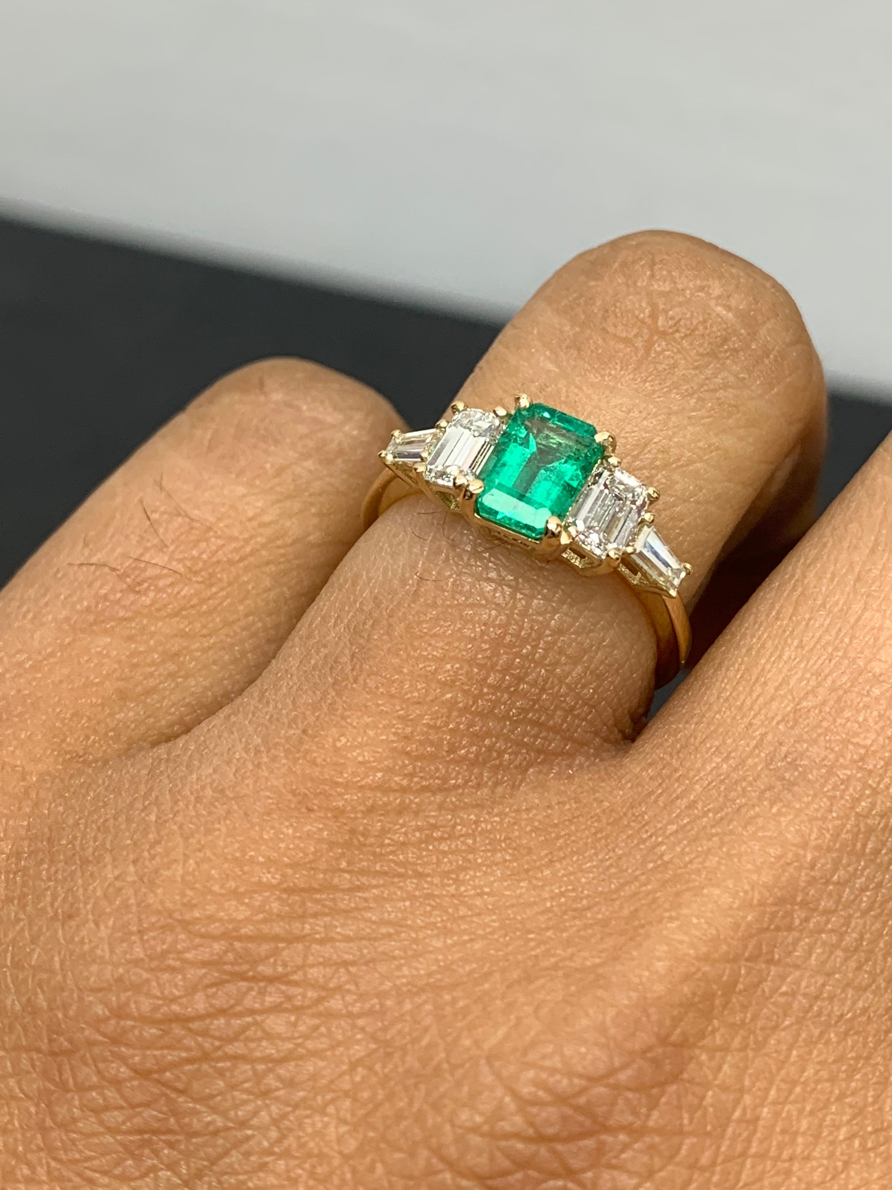 Modern 0.72 Carat Emerald Cut Emerald and Diamond 5 Stone Ring in 14K Yellow Gold For Sale