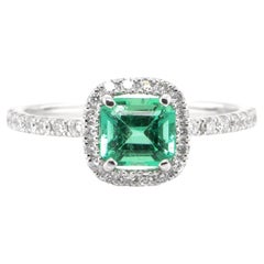 0.72 Carat Natural Emerald and Diamond Halo Ring Set in Platinum