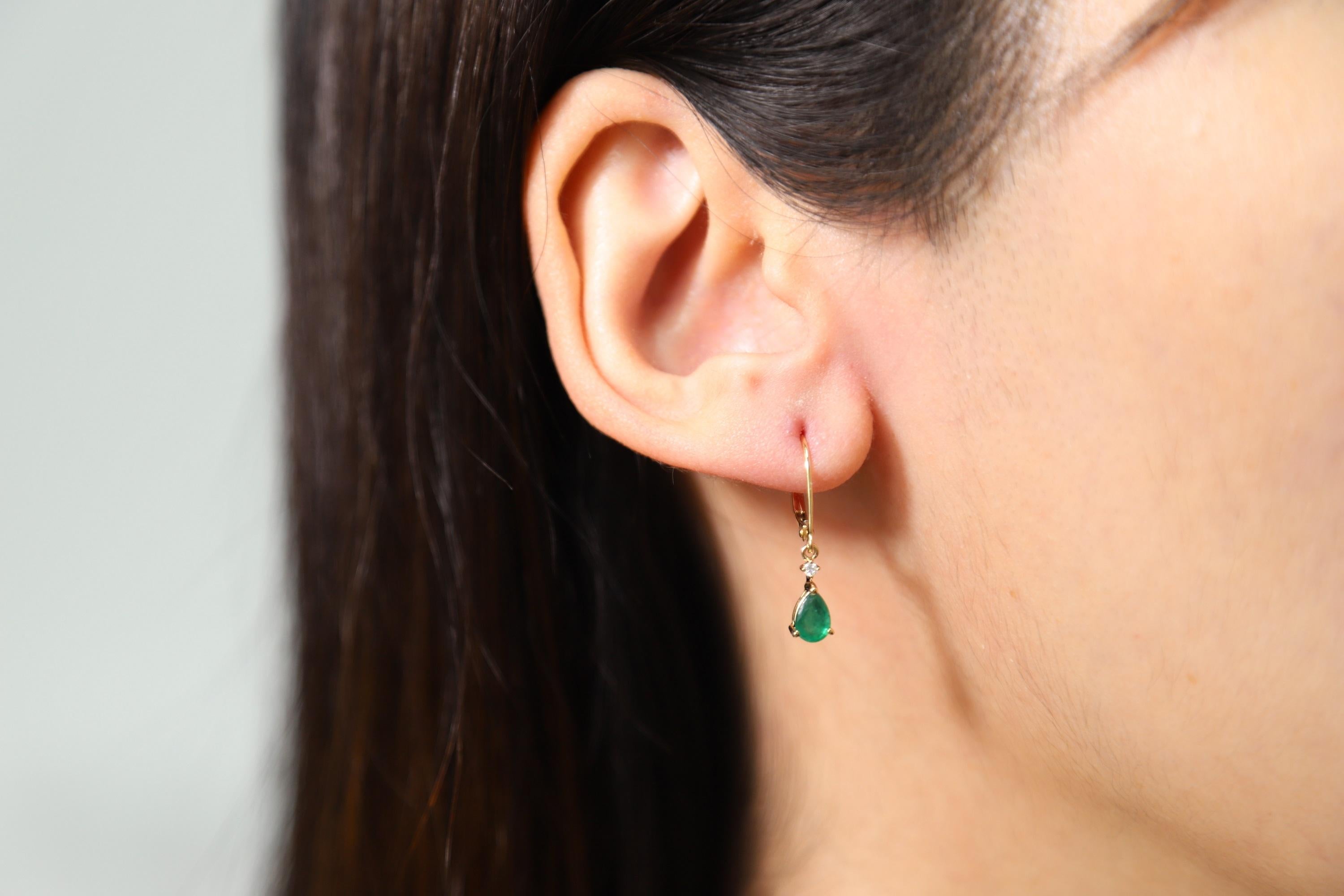 Decorate yourself in elegance with this Earring is crafted from 14K Yellow Gold by Gin & Grace Earring. This Earring is made up of 4X6 Pear-Cut prong setting Emerald (2 pcs) 0.72 Carat and Round-Cut prong setting Diamond (2 pcs) 0.03 Carat. This