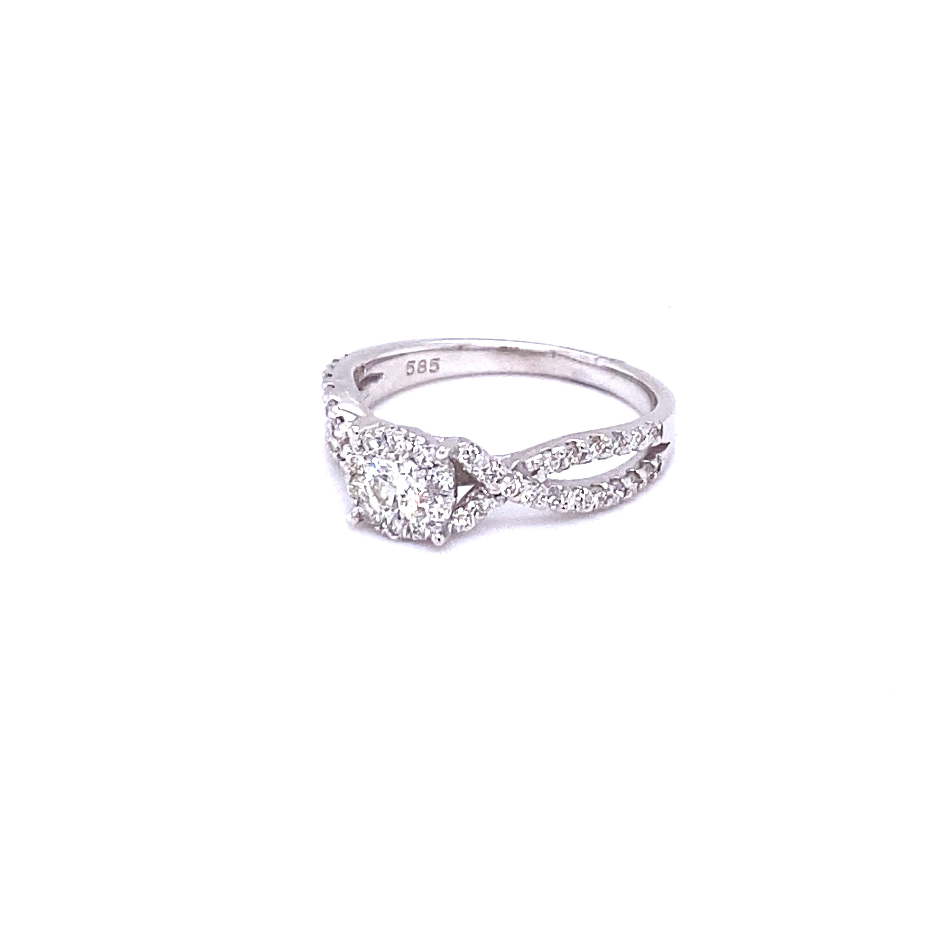 A beautiful and affordable option for a Bridal/ Engaement ring.  
Round Cut Diamond cluster ring that has 45 Diamonds that weigh a total of 0.72 Carats.  
The Clarity and Color of the Diamonds is VS2-H.

It is set in 14K White Gold and is 3.4 Grams.