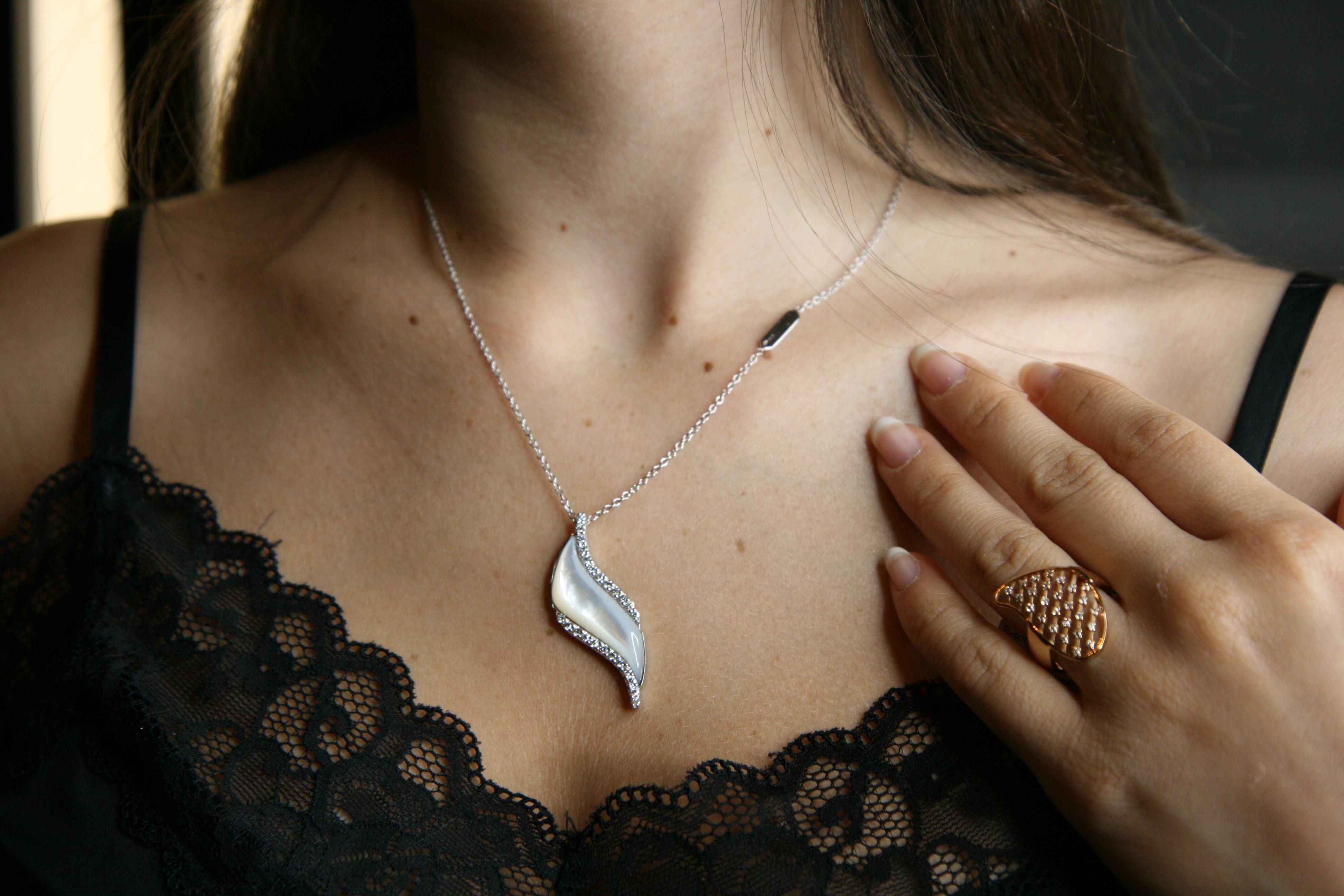 john mayer feather necklace