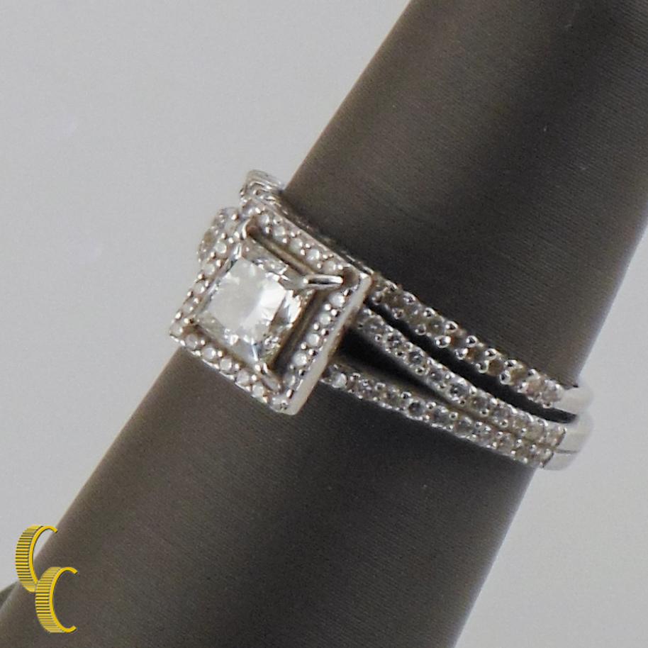 One Electronically tested 18k white gold ladies cast & diamond unity ring. Condition is very good. Featuring a diamond solitaire set within a bezel of diamonds, supported by split diamond shoulders, completed by a three millimeter wide band.