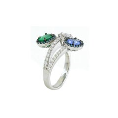 0.72 Cts Emerald and 0.66 Cts Tanzanite Ring