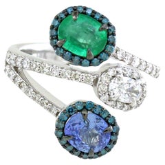 0.72 Cts Emerald and 0.66 Cts Tanzanite Ring