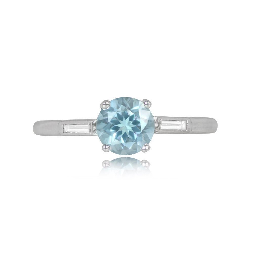 This gemstone ring highlights a 0.72-carat round-cut aquamarine in prongs, with shoulders adorned by baguette-cut diamonds totaling about 0.10 carats. Crafted in platinum.


Ring Size: 6.5 US, Resizable
Metal: Platinum
Stone: Diamond,