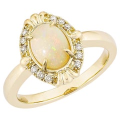0.73 Carat Ethiopian Opal Fancy Ring in 14Karat Yellow Gold with White Diamond.