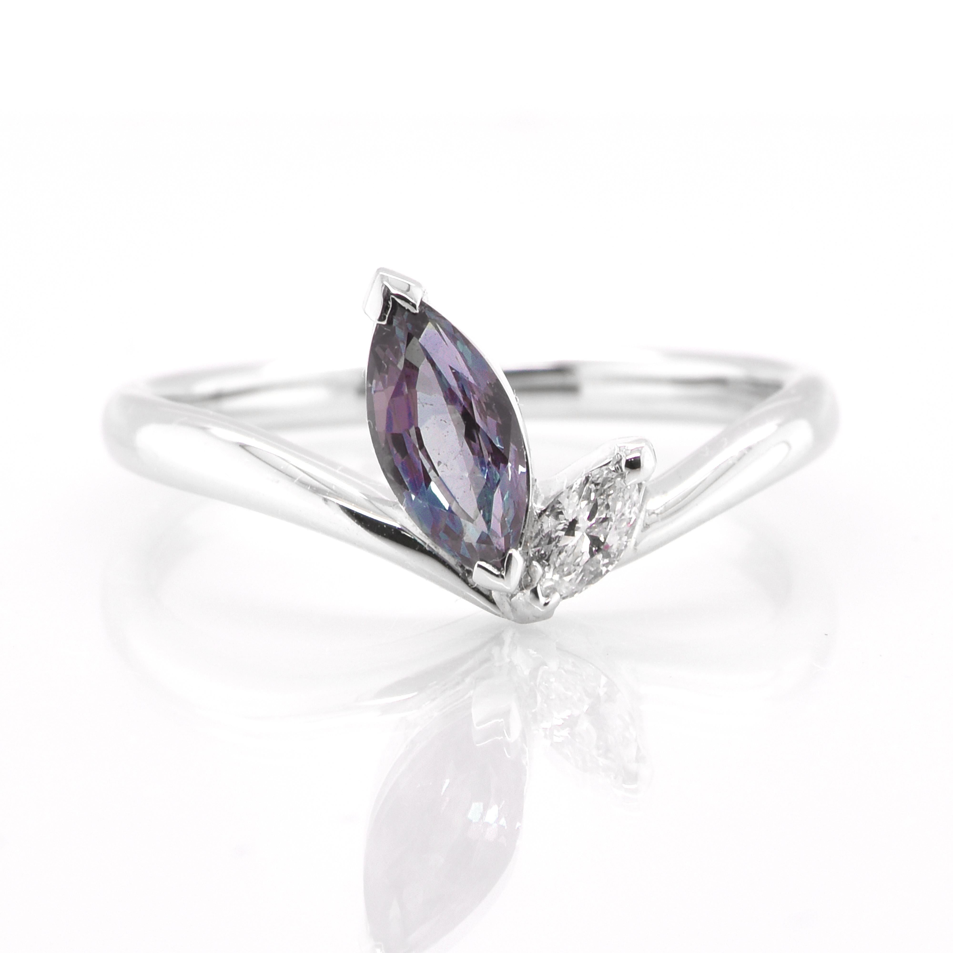 A gorgeous Fashion featuring a 0.73 Carat, Natural Alexandrite and 0.10 Carats of Diamond Accents set in Platinum. Alexandrites produce a natural color-change phenomenon as they exhibit a Bluish Green Color under Fluorescent Light whereas a Purplish