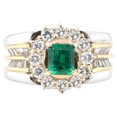 0.73 Carat Natural Emerald and Diamond Cocktail Ring Set in Platinum 
18K Gold