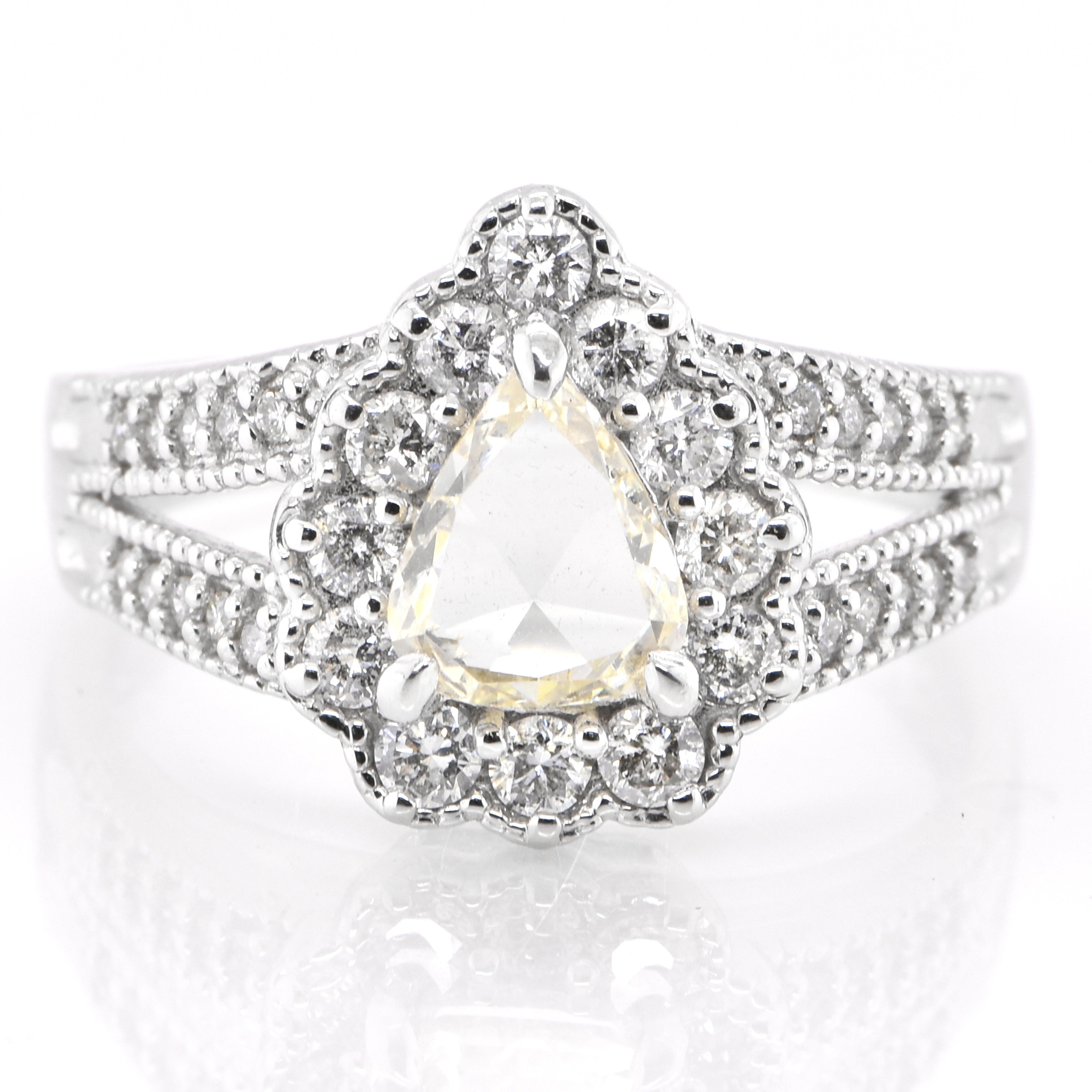 A beautiful halo ring featuring a 0.73 Carat Natural Rose Cut Diamond and 0.54 Carats Diamond accents Ring set in Platinum. Diamonds have been adorned and cherished throughout human history and date back to thousands of years. They are rated as 10
