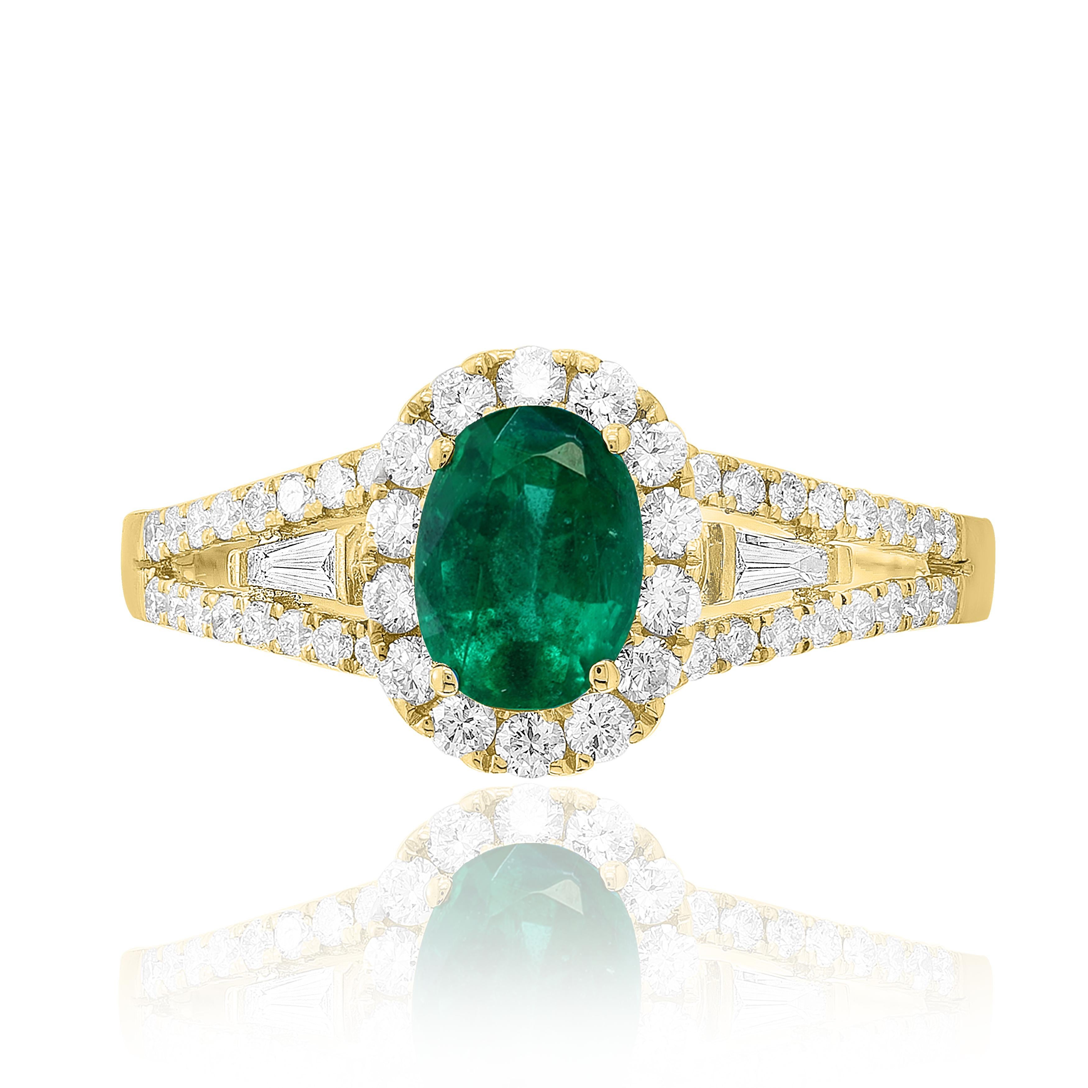 A fashionable and classic ring showcasing color-rich oval cut emerald weighing 0.73 carats total. Surrounded by a row of brilliant cut 48 accent diamonds weighing 0.52 carats in total. made in 18K  yellow gold. A versatile piece that can be worn as