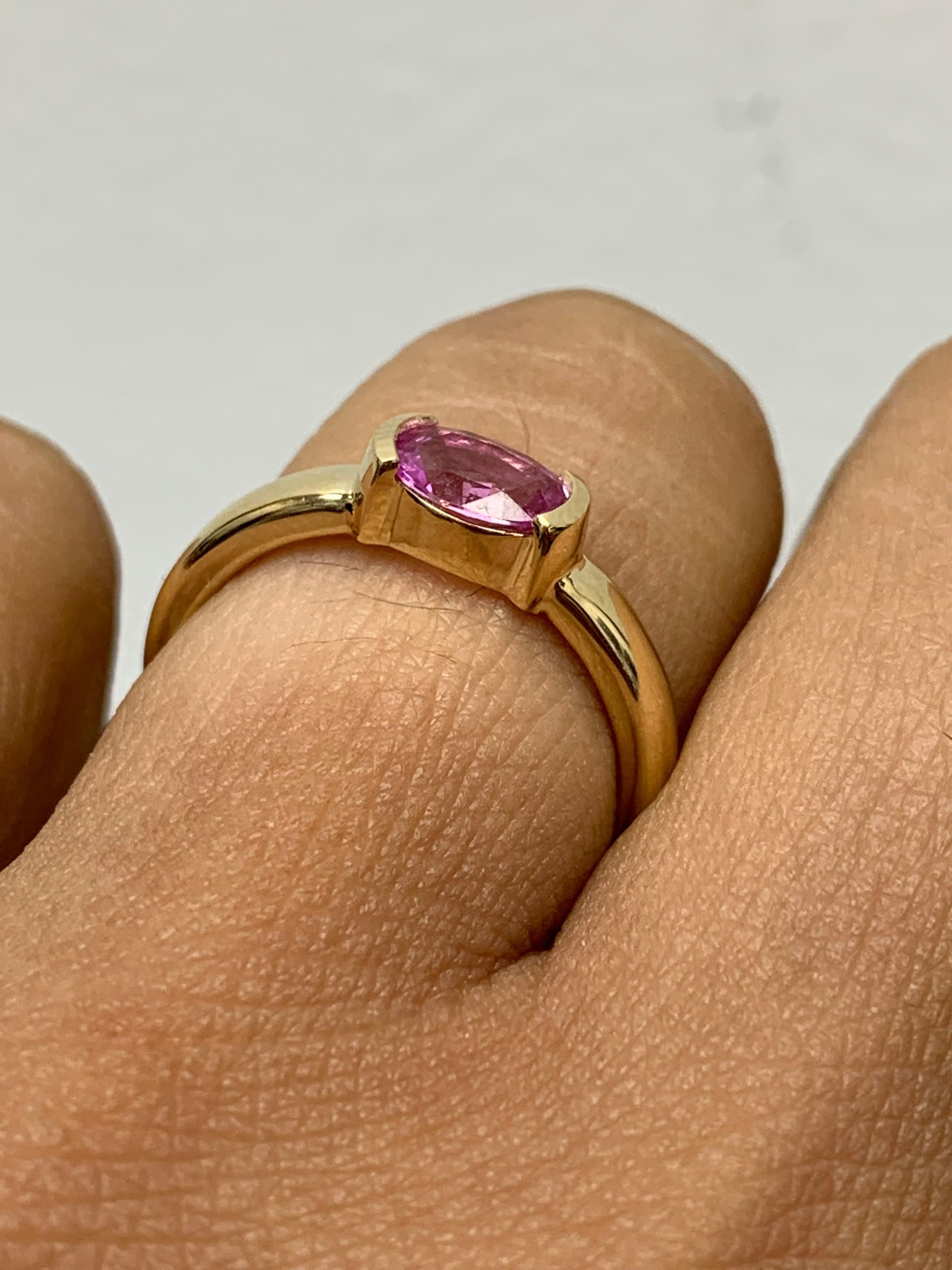 0.73 Carat Oval Cut Pink Sapphire Band Ring in 14K Yellow Gold For Sale 7