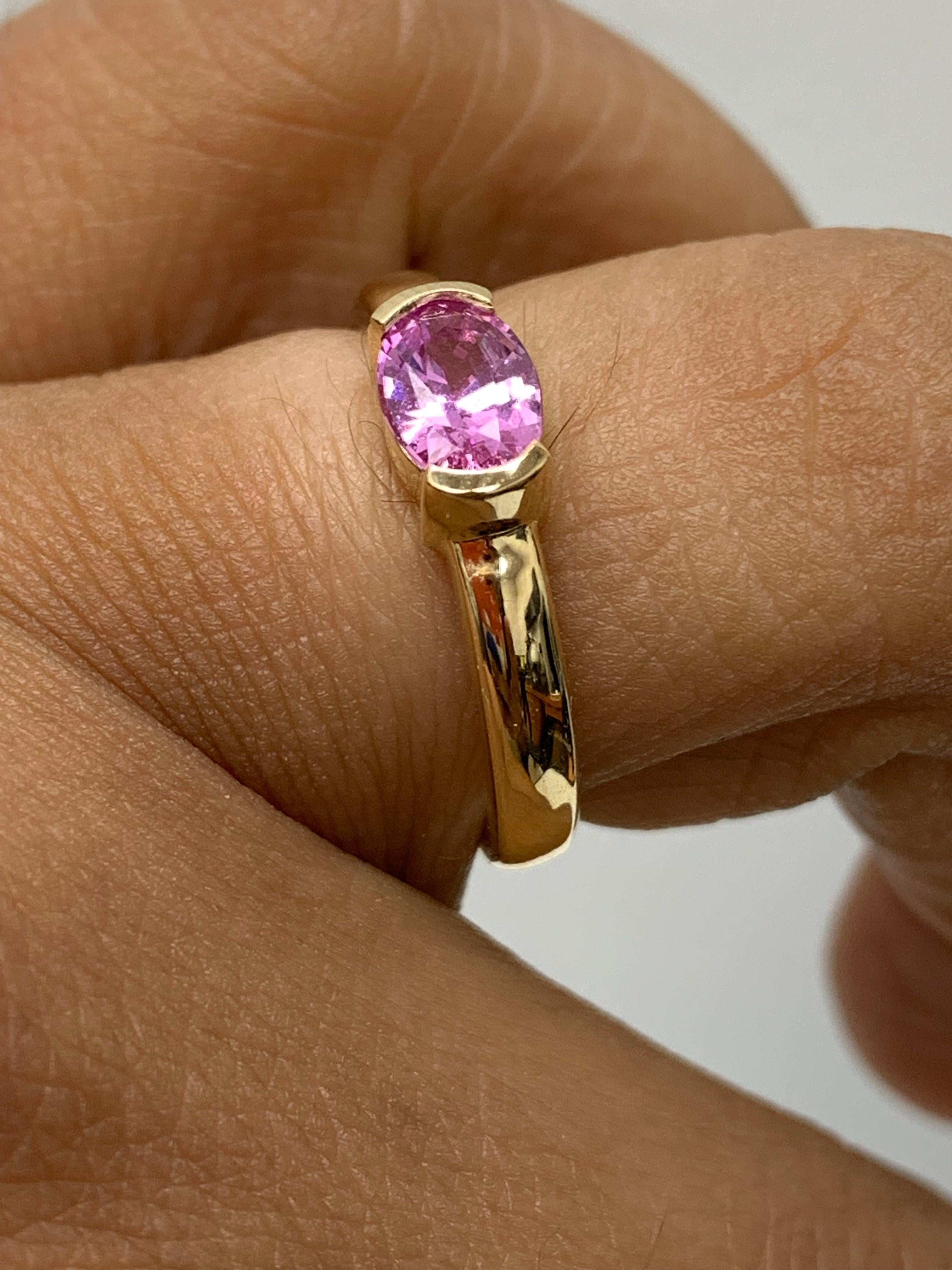 0.73 Carat Oval Cut Pink Sapphire Band Ring in 14K Yellow Gold For Sale 1